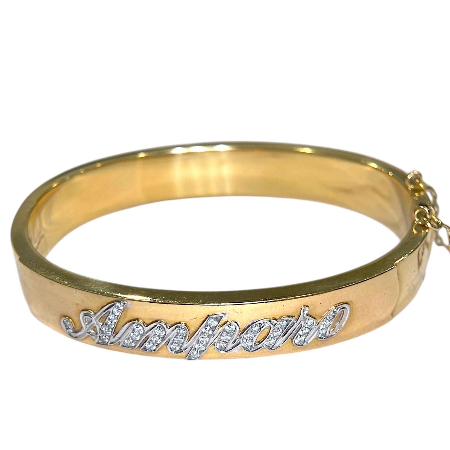 Bracciale bangle a cerniera in oro giallo 18 carati vintage con la scritta 