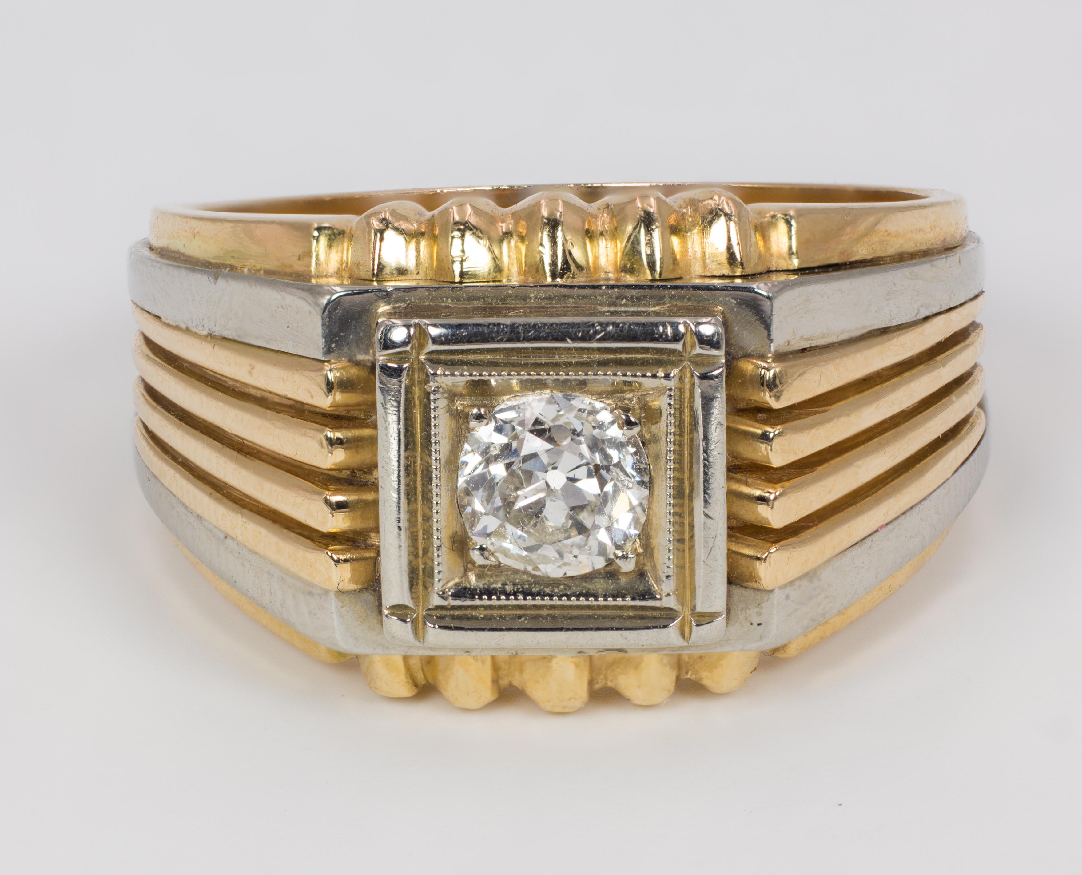 A vintage men's ring, dating from the 1950s, crafted in both 18K yellow and white gold. It is decorated with a central 0.50ct (circa) old European cut diamond, set in a gold square; it has also pretty details on the mount and on the shoulders.
