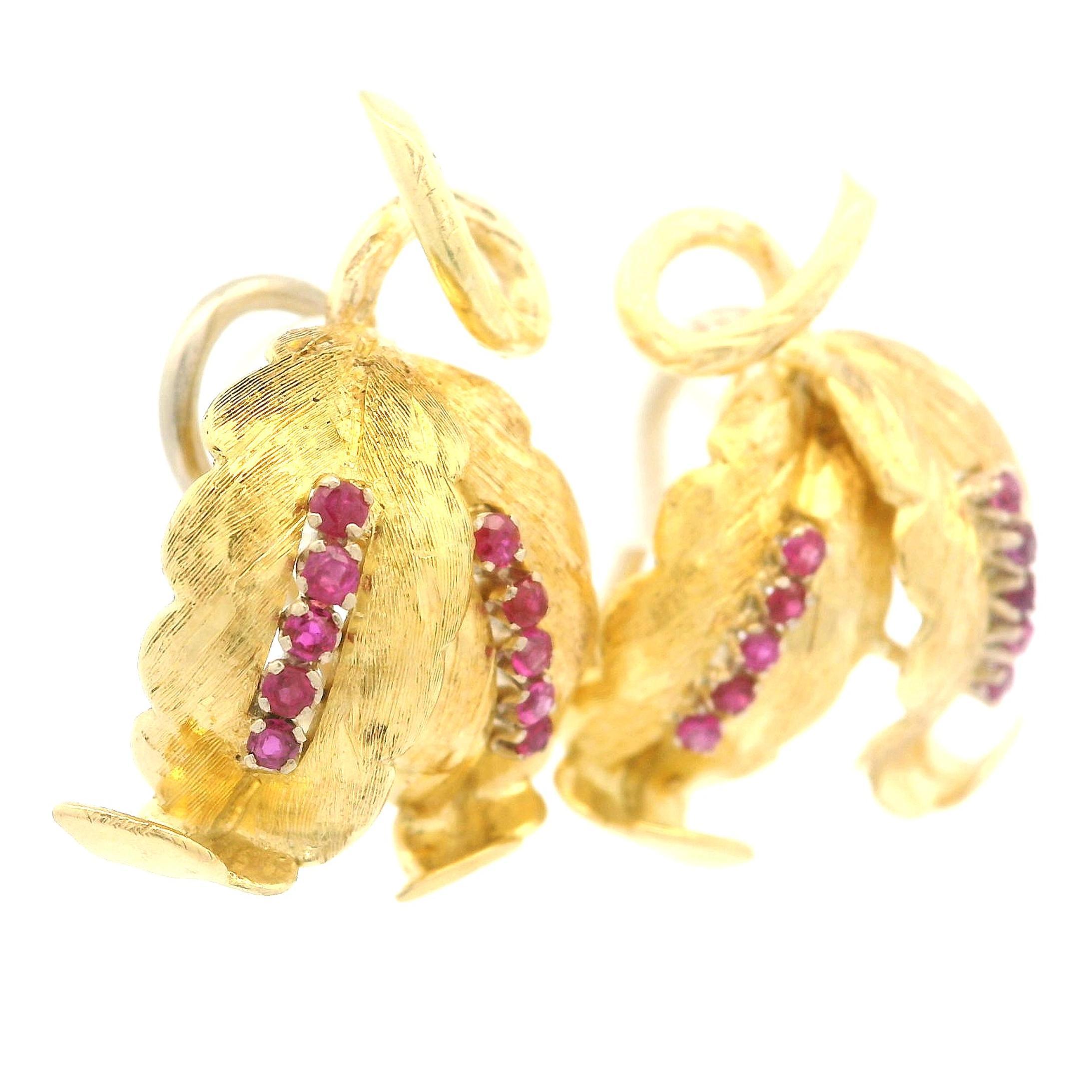 -- Stone(s) --
(20) Natural Genuine Ruby - Round Brilliant Cut - Prong Set -Vibrant Pinkish Red Color - 0.30-.40ctw (approx.)

Material: Solid 18K Yellow Gold - 18k White Gold Backs
Weight: 12.46 Grams
Backing: Post Backs w/ Omega Closures (Pierced