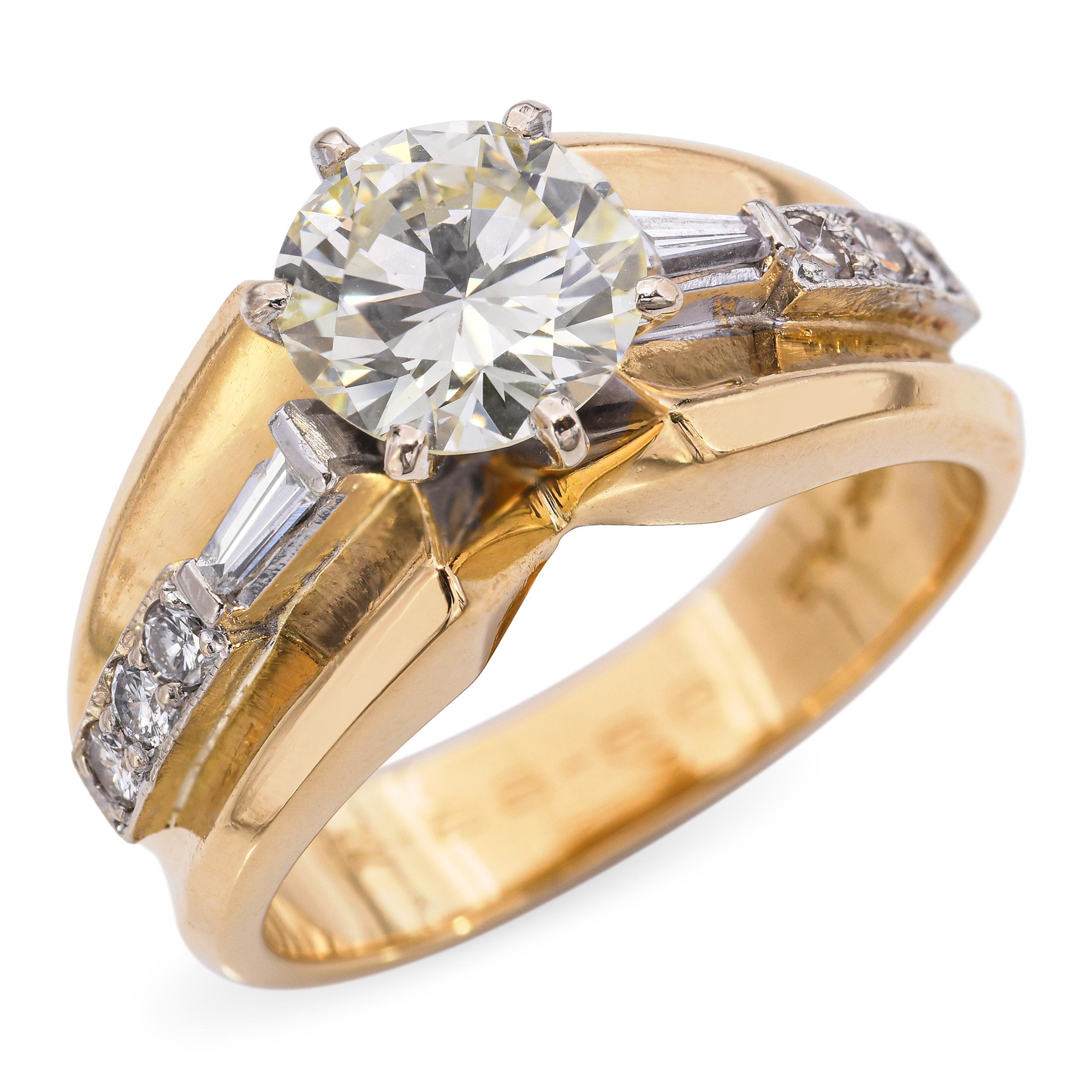 This vintage engagement ring features a warm and romantic 1.55 total carats of natural diamonds set in classic 18k yellow gold. At its center is a sparkling round brilliant diamond graded approximately O color and SI2 clarity, offering a beautiful