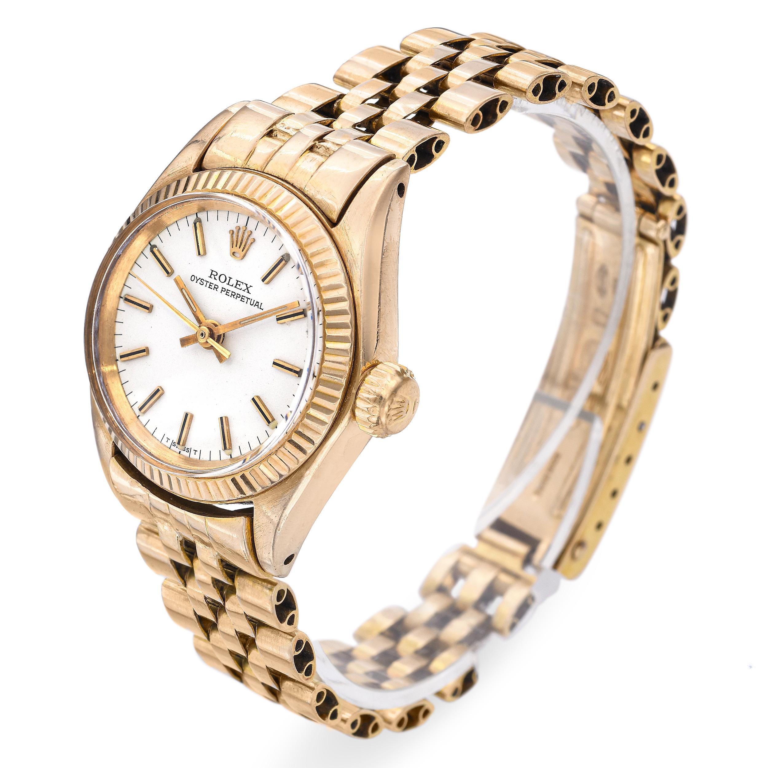 Crafted in 18k yellow gold, this 1957 Rolex Oyster Perpetual ladies watch (Ref. 313315) embodies timeless elegance and enduring craftsmanship. Its 24mm case houses a self-winding movement, known for precision and reliability. The classic dial is