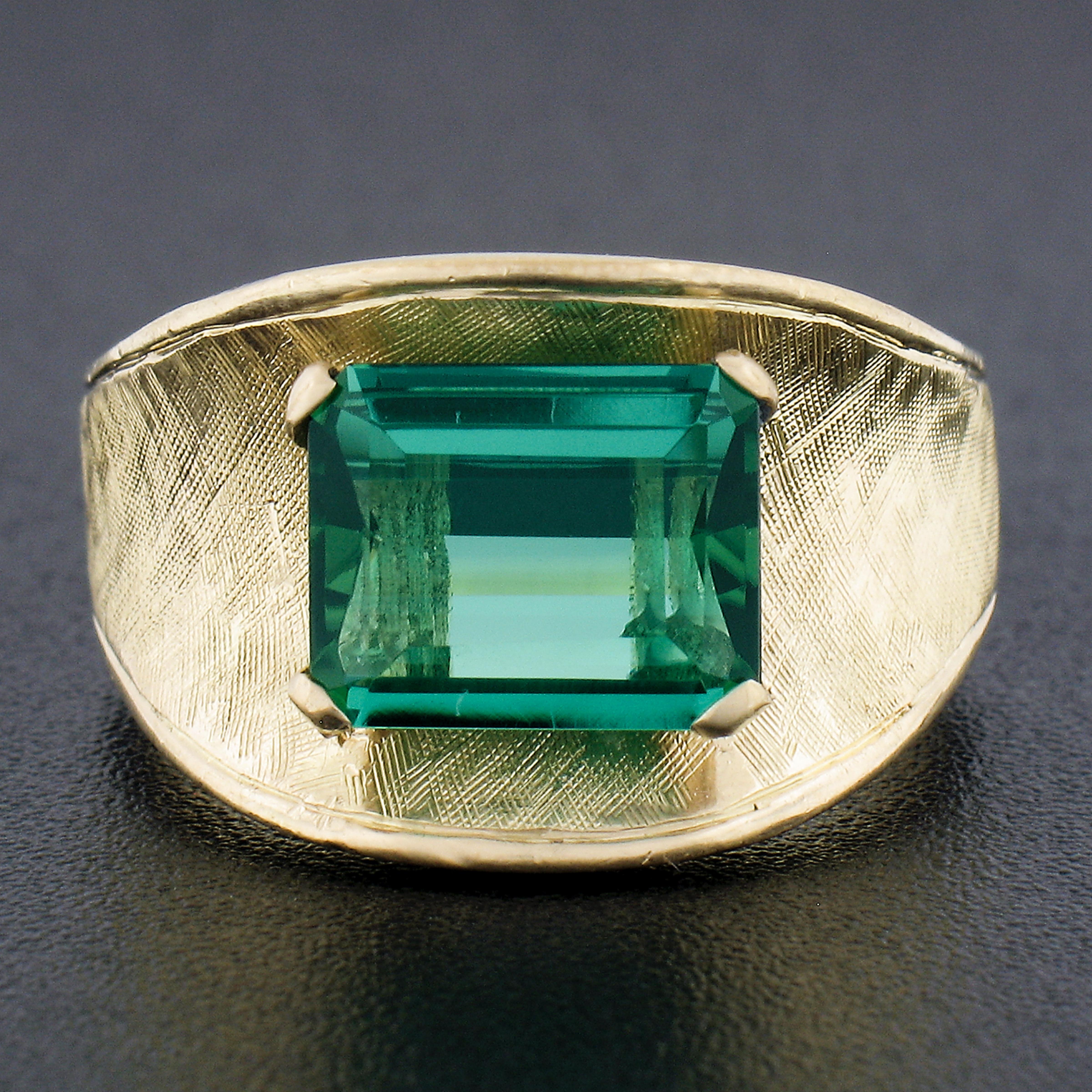 Gorgeous tourmaline! Enjoy!

--Stone(s):--
(1) Natural Genuine Tourmaline - Emerald Cut - Prong Set - Slightly Bluish Green Color - 7.8x9.4mm - 2.50ct (exact)
Total Carat Weight:	2.50 (exact)

Material: Solid 18k Yellow Gold
Weight: 11.41 Grams
Ring