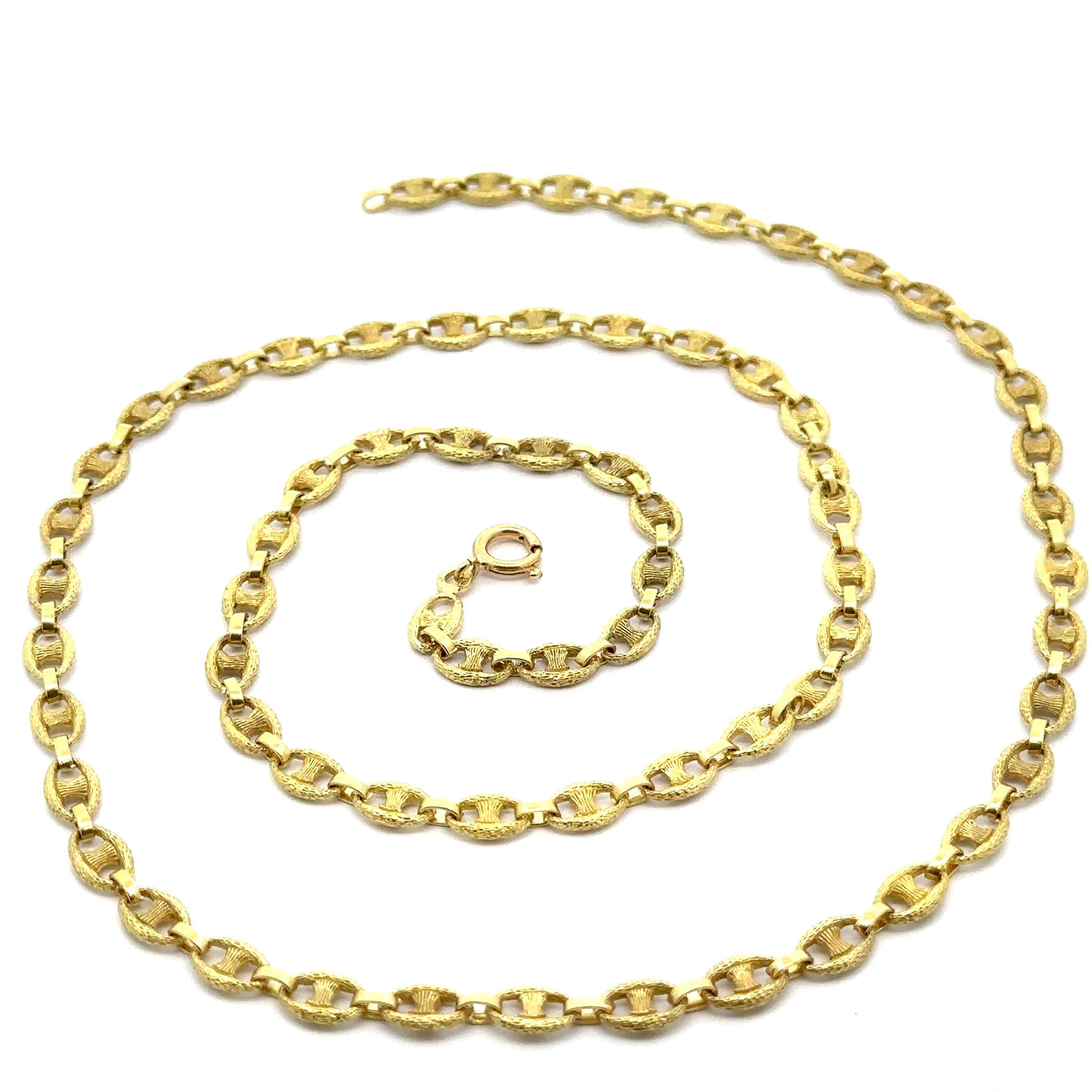 Material: Solid 18k Yellow Gold
Weight: 41.54 Grams
Chain Type: Textured Mariner Link
Overall Length: 28” (measured on a neck)
Overall Width: 5.82mm (0.22