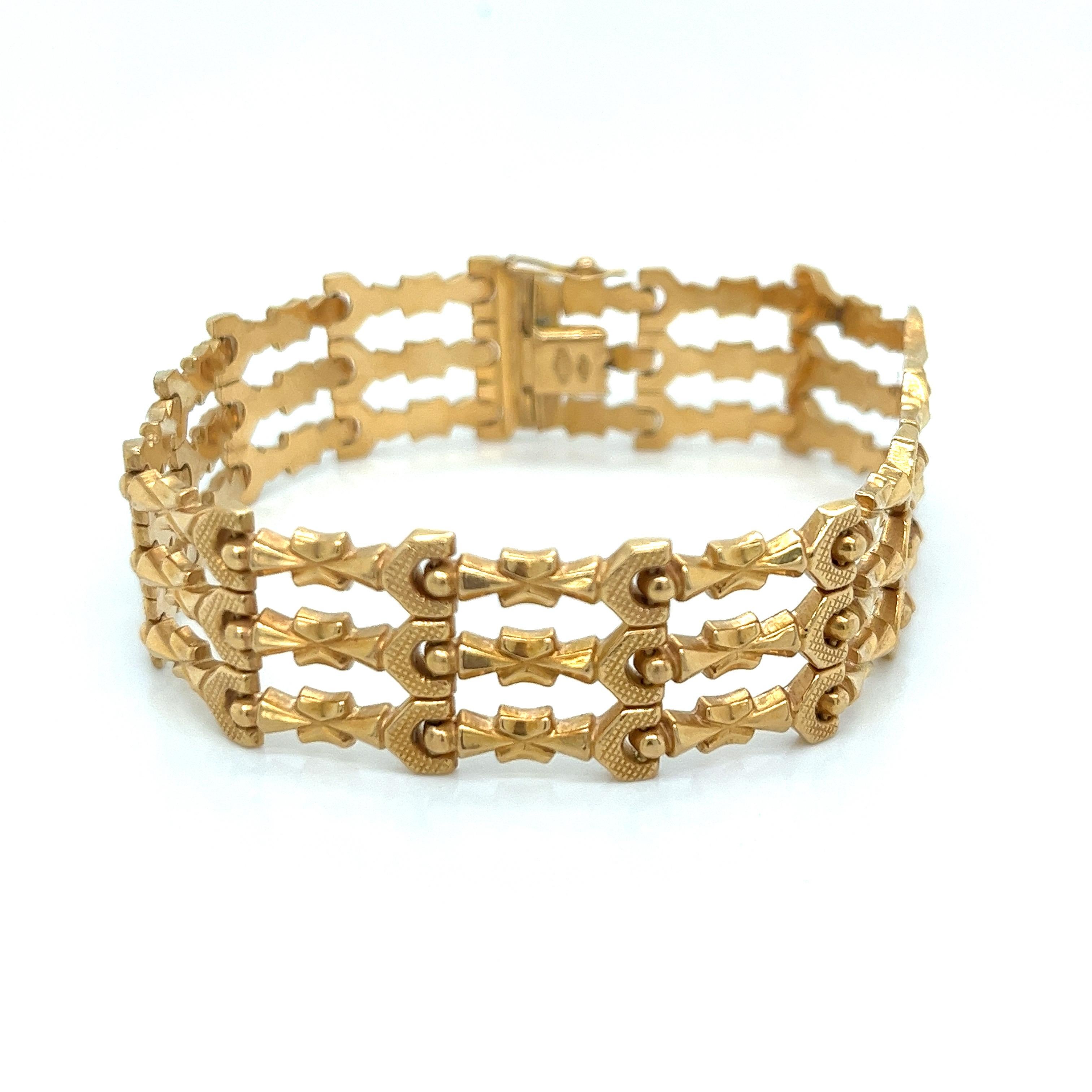 A stunning exemplar of mid-20th century jewelry artistry, this vintage bracelet from the 1940s-1950s era exudes timeless elegance and sophistication. Masterfully crafted in rich 18k yellow gold, verified by the 750 stamp, the design features a bold