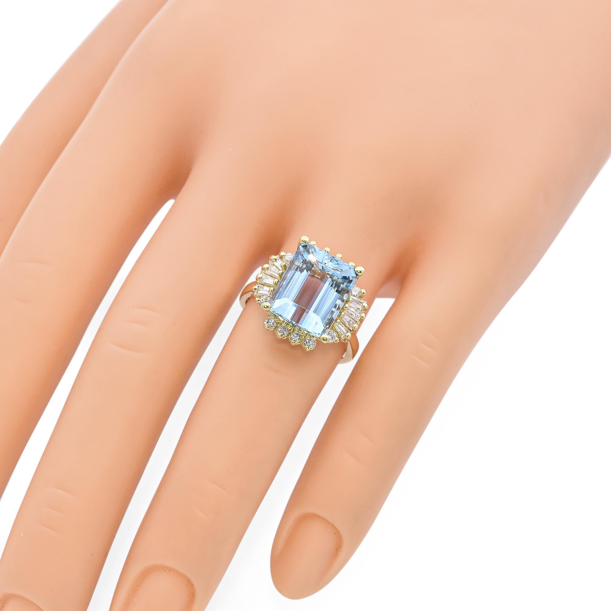 This stunning vintage ring showcases a vibrant 7.25-carat aquamarine set in rich 18k yellow gold, accented by approximately 0.75 carats of sparkling diamonds. The bold center stone radiates a serene blue hue, beautifully complemented by the