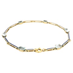 Bar-Gliederarmband aus 18 Karat Gelbgold mit abwechselnd Aquamarin und blauer Emaille