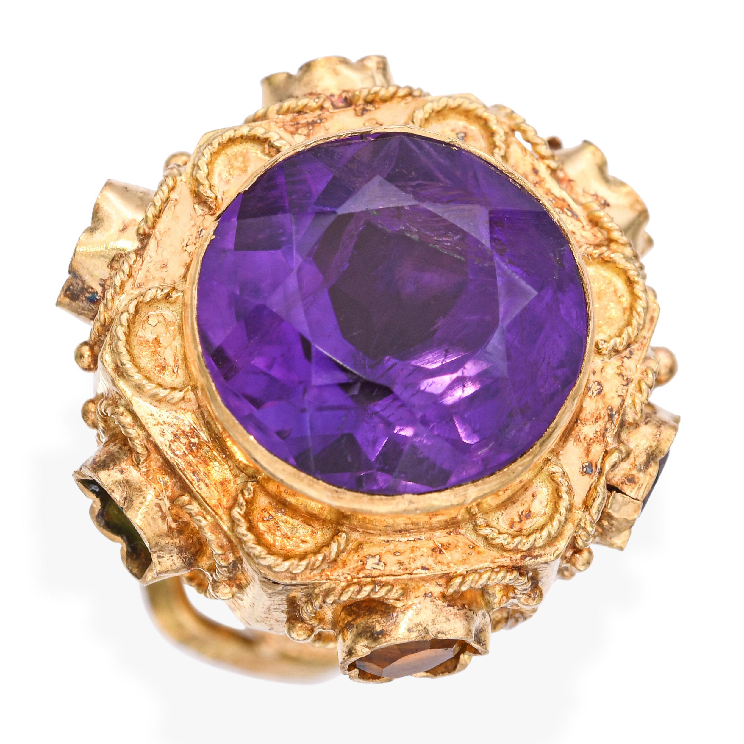 Ce magnifique pendentif en or jaune 14 carats est orné d'une améthyste aux teintes riches et d'une tourmaline vibrante. La combinaison des pierres crée un jeu de couleurs saisissant, rehaussé par la monture en or chaud. Une pièce polyvalente et