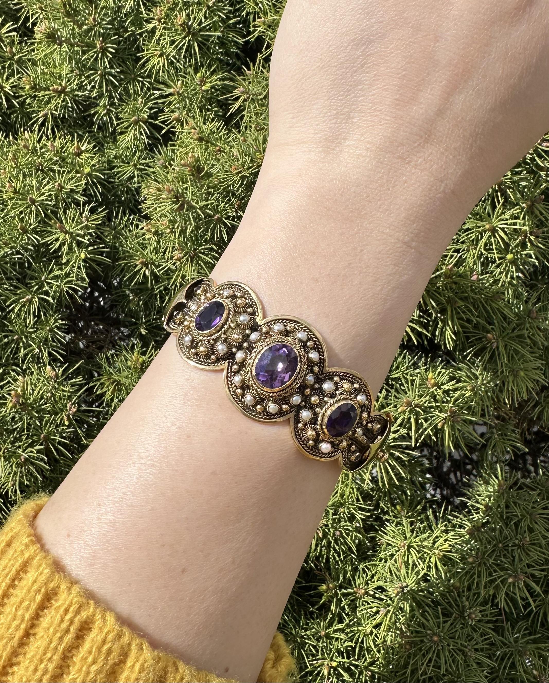 Vintage Magnificent Substantial Handmade Bracelet
--Stone(s):--
(3) Natural Genuine Amethysts - Oval Brilliant Cut - Bezel Set - Deep Purple Color - 11.1x8.7mm (center), 8.6x6.5mm (sides) (approx.)
(4) Natural Genuine Amethyst - Single Cut - Bezel