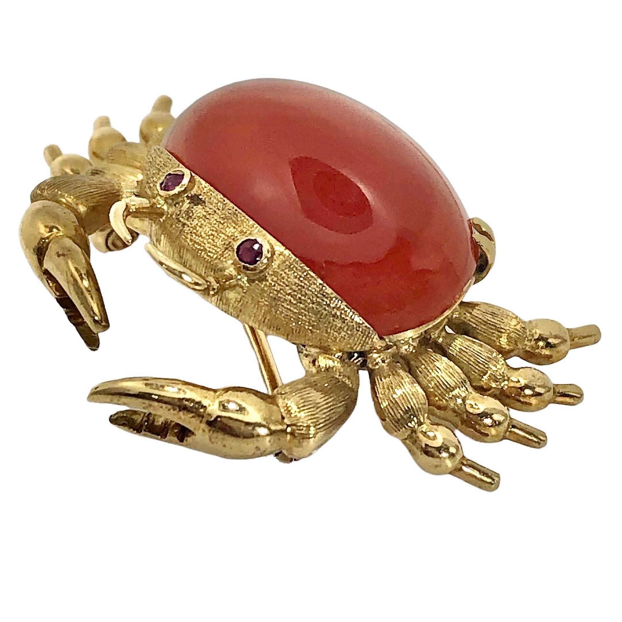 This realistically crafted Italian brooch is quite convincing in appearance because of the great attention paid to detail.  The 18K yellow gold body is 
set with a carnelian carapace and with bezel set ruby eyes. The brooch measures 15/16 inches in
