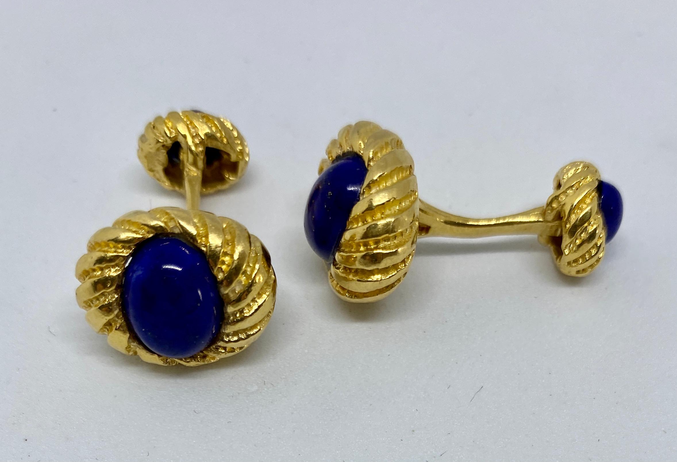 A classic design, these double-sided cufflinks feature four cabochon-cut lapis ovals set in 18K yellow gold.

These cufflinks were designed by Jean Schlumberger for Tiffany & Co. However, some overly zealous cleaning buffed out the marks on the