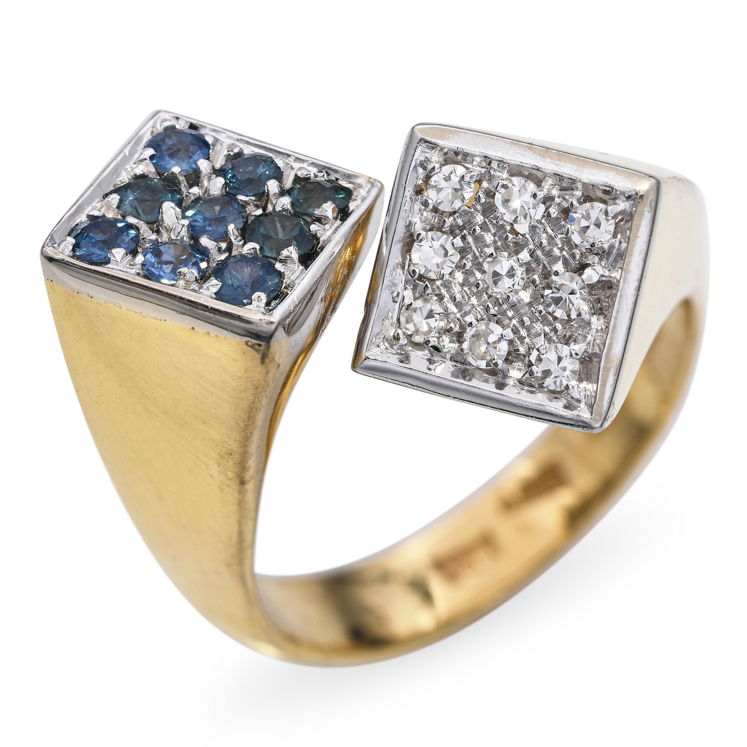 Cette élégante bague vintage est réalisée en or jaune 18 carats et en platine et présente un gracieux contournement. À chaque extrémité de la boucle, des saphirs vibrants et des diamants étincelants créent un contraste saisissant de couleurs et