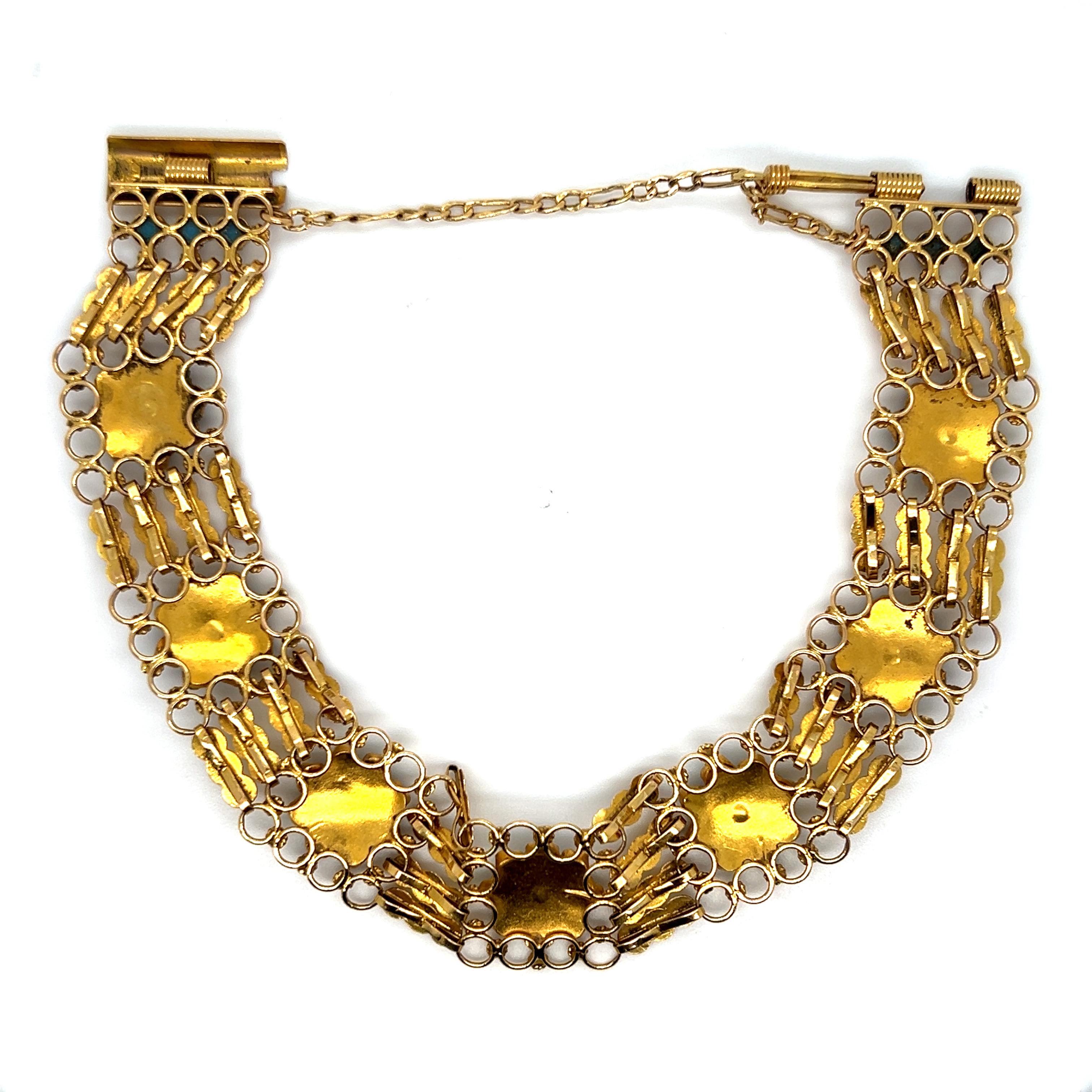 This Stunning Vintage 18K Yellow Gold and Turquoise Bracelet is so detailed and well done! Crafted in 18K Yellow Gold, the bracelet features numerous links, all hand attached, and then studded with rosette of turquoise beads. 

Other Important