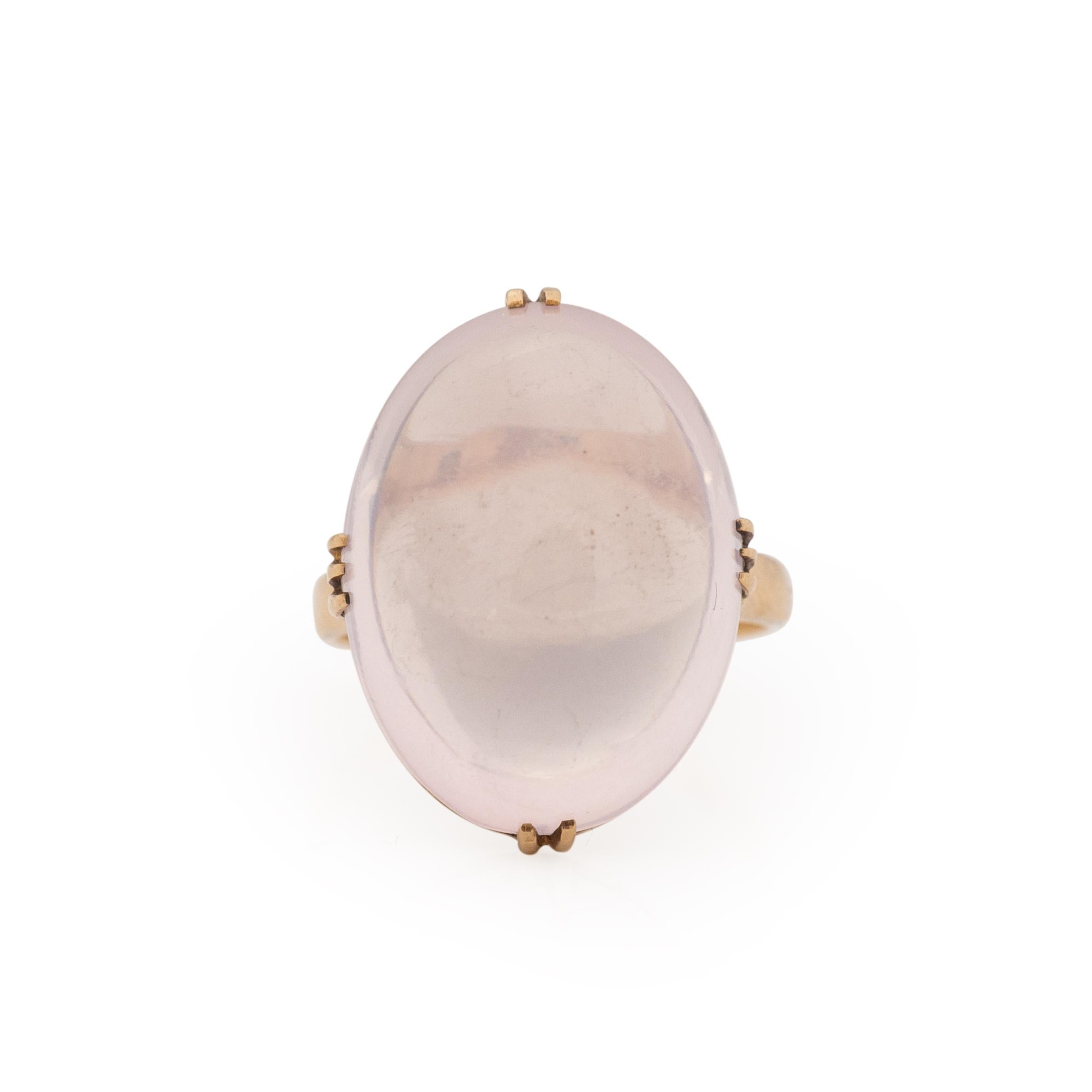 Here we have a unique beauty. The center moonstone is approximately 18.3Ct oval cabochon that has a outstanding lavender color to it. The prong setting holding the gum drop shaped moonstone is crafted in 18K yellow gold. This mount is perfect for