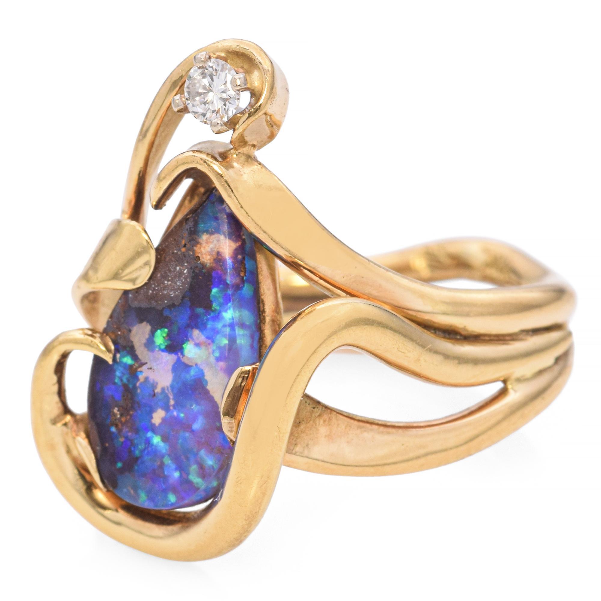 Crafted in 18K yellow gold, this ring features a mesmerizing boulder opal as its centerpiece. The opal's vibrant play of colors is beautifully complemented by the fluid, organic lines of the gold setting. The design captures a sense of movement,