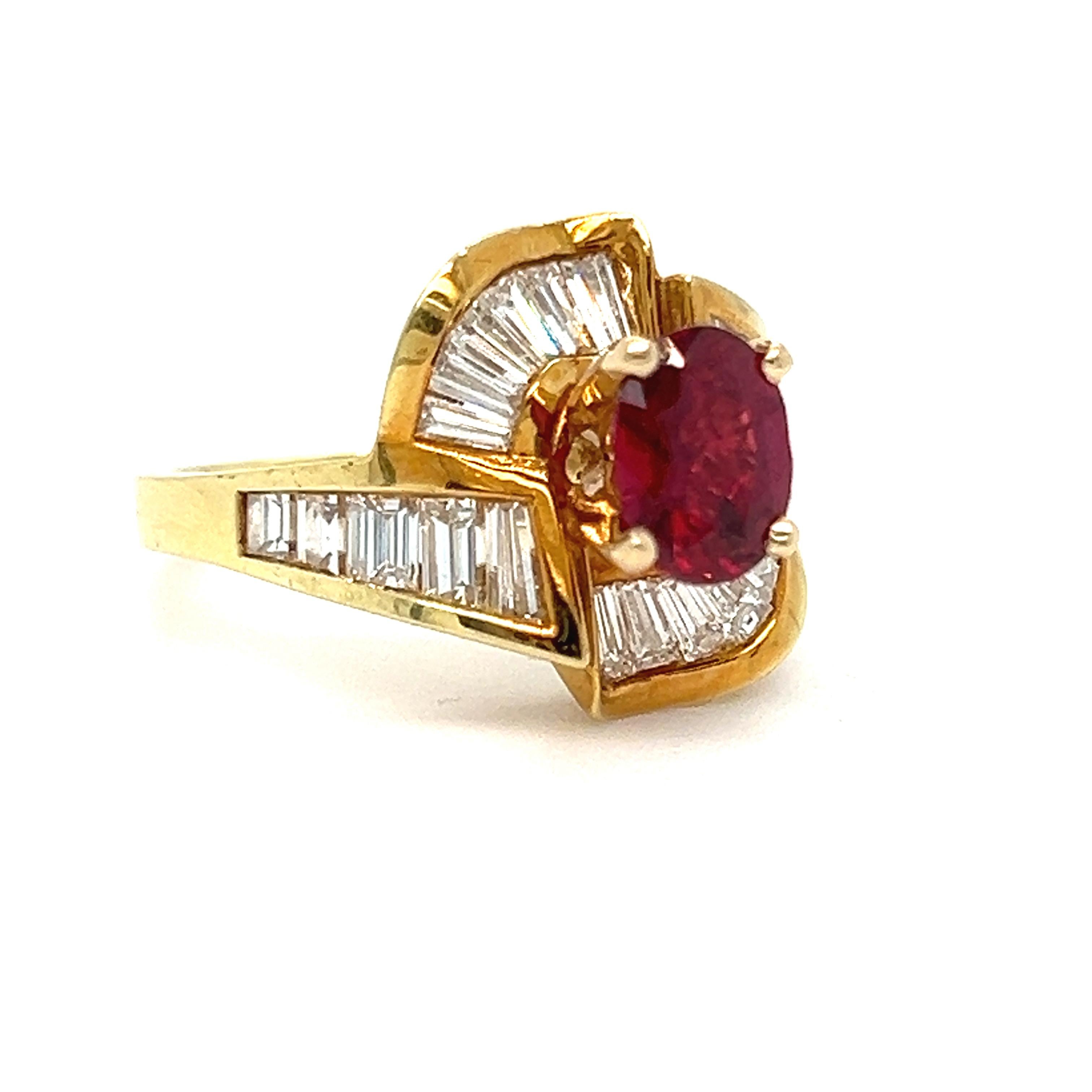 Stunning and high quality are the words that come to mind with this Vintage Baguette Diamond and Ruby Ring. Crafted in an incredibly rich 18K Yellow Gold, the design features a ribbon with Baguette Cut Diamonds, around a truly gorgeous natural Ruby.