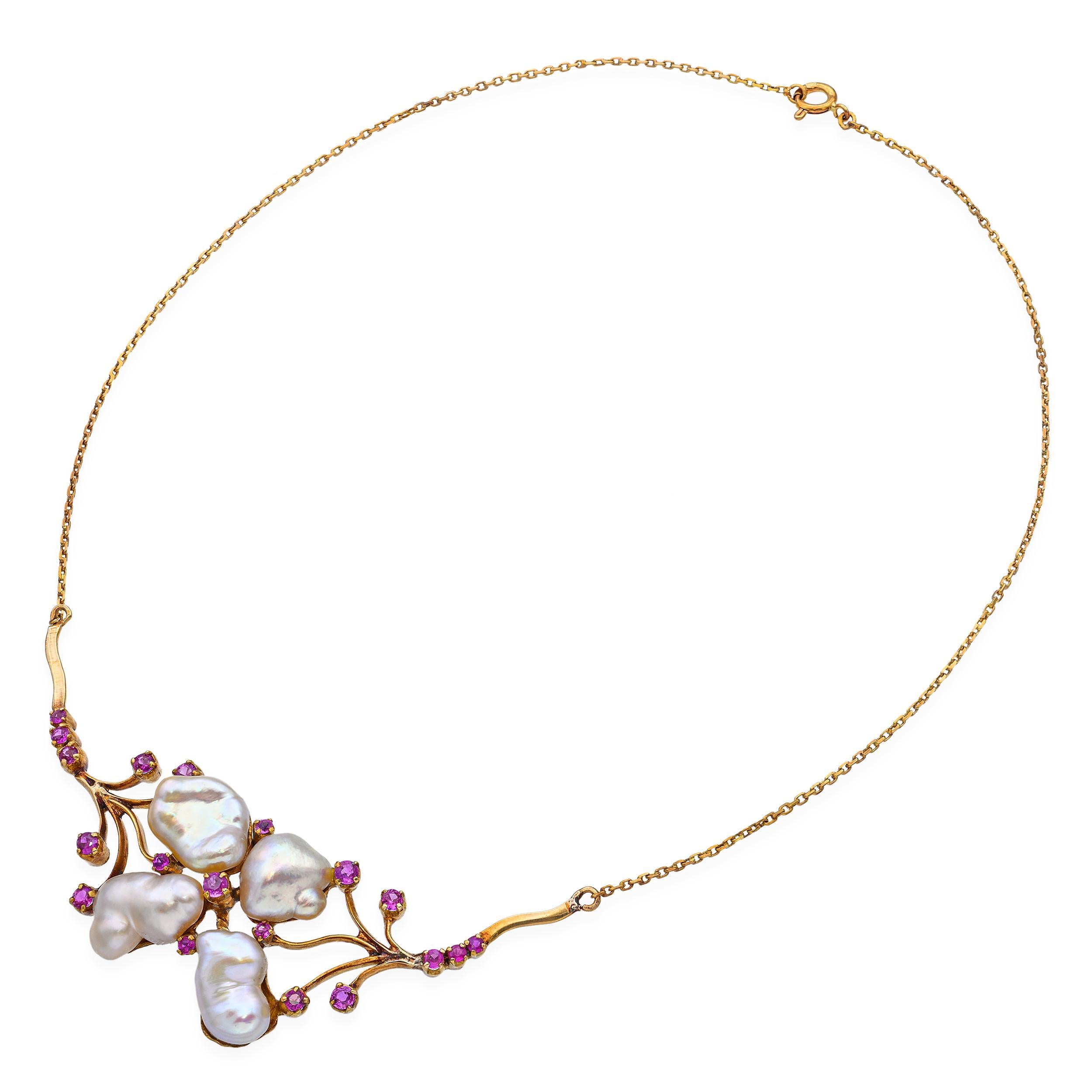 This vintage necklace is crafted in rich 18k yellow gold and showcases four lustrous baroque pearls, each uniquely shaped and full of organic charm. The pearls are adorned by an elegant, tree branch–inspired gold design that evokes a natural,