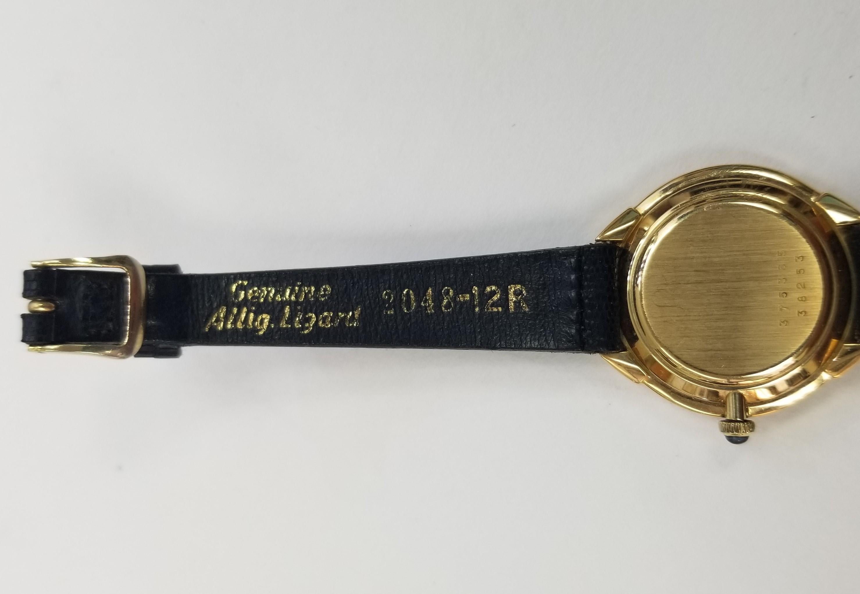 Contemporary Vintage 18k Yellow Gold Baume & Mercier with Arabic Numbers Gold Dial on a Strap For Sale