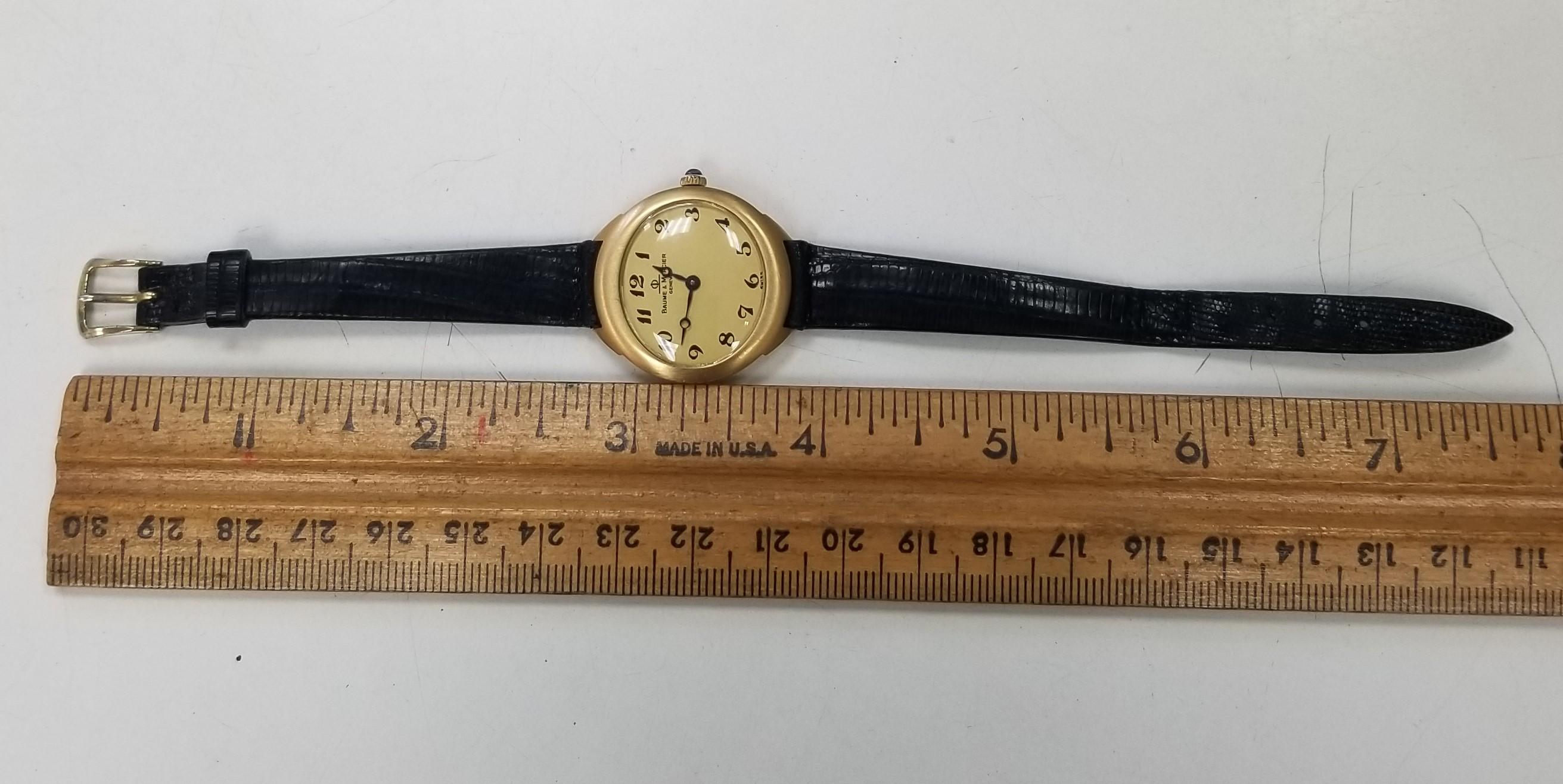 Women's or Men's Vintage 18k Yellow Gold Baume & Mercier with Arabic Numbers Gold Dial on a Strap For Sale