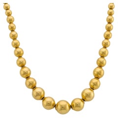 Vintage 18k yellow gold beaded necklace