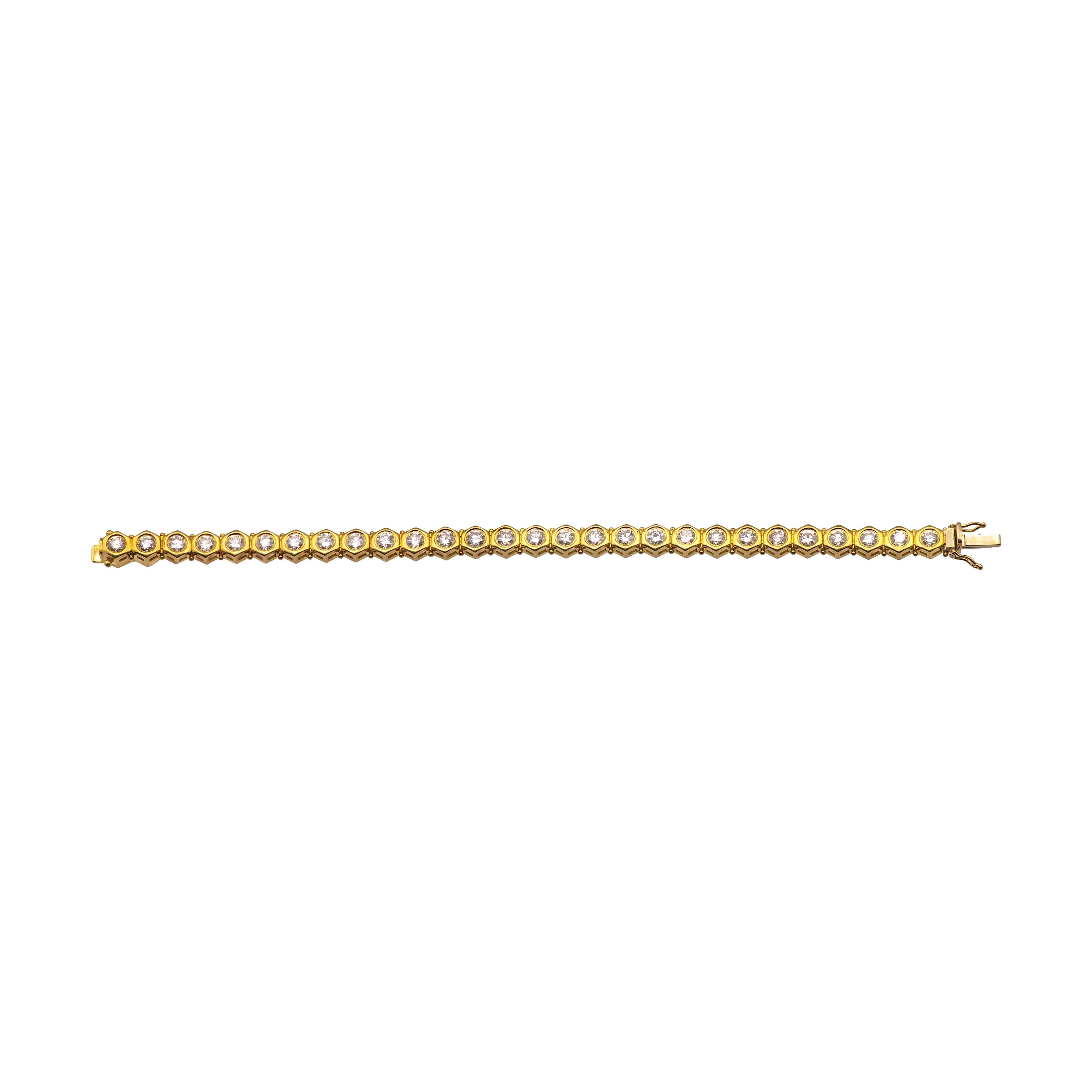 This vintage diamond tennis bracelet, crafted in 18K yellow gold, features 28 bezel-set diamonds with a total weight of 8.40 carats. The diamonds are beautifully matched with excellent cuts, providing a consistent brilliance and shine throughout the