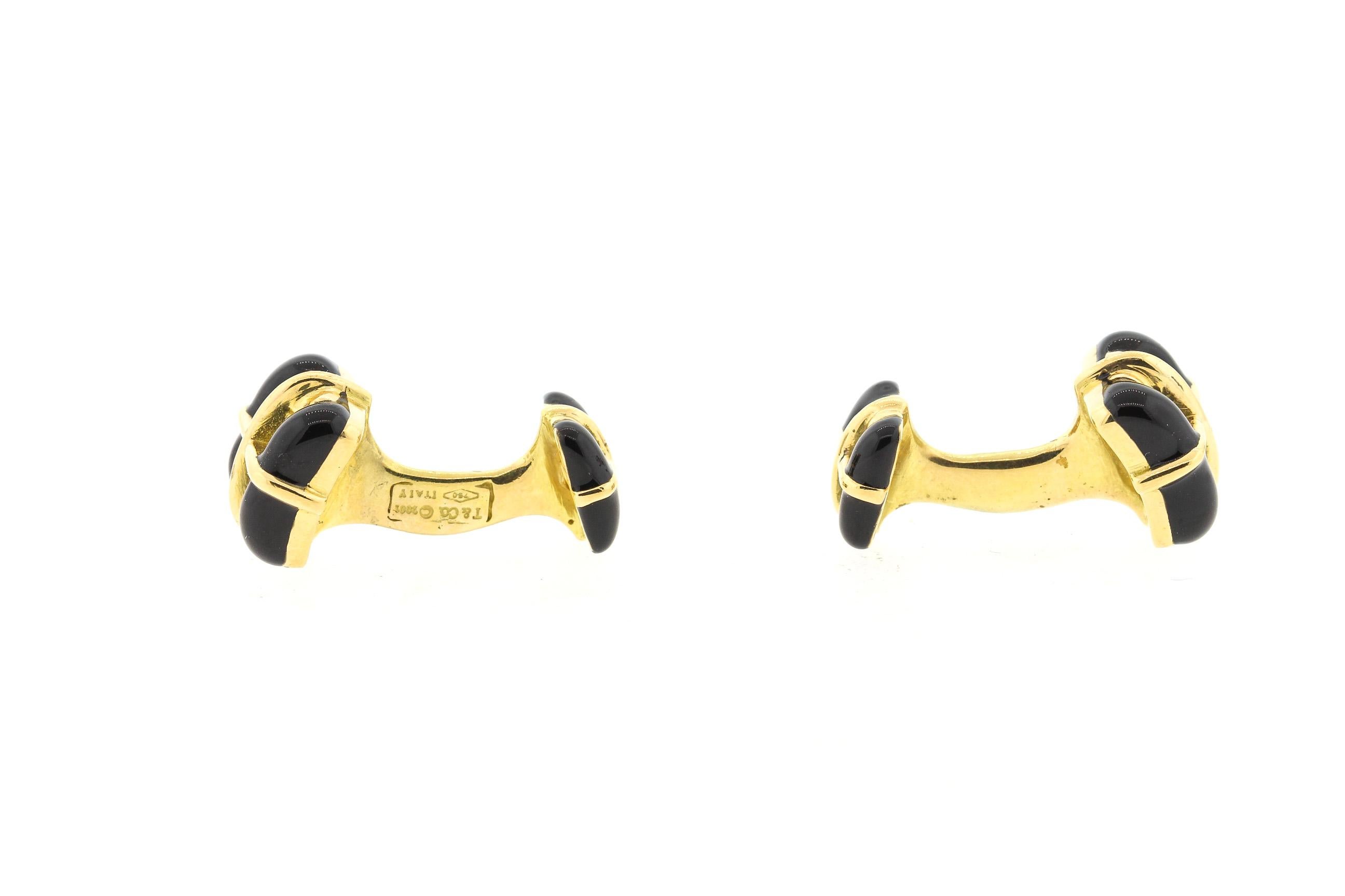 A pair of vintage 18k yellow gold black enamel square cufflinks by Tiffany & Co., made in 2001. These double sided cufflinks are distinguished and wearable by both men and women. They are stamped T&Co. 750 and Italy with the year 2001. They are 1