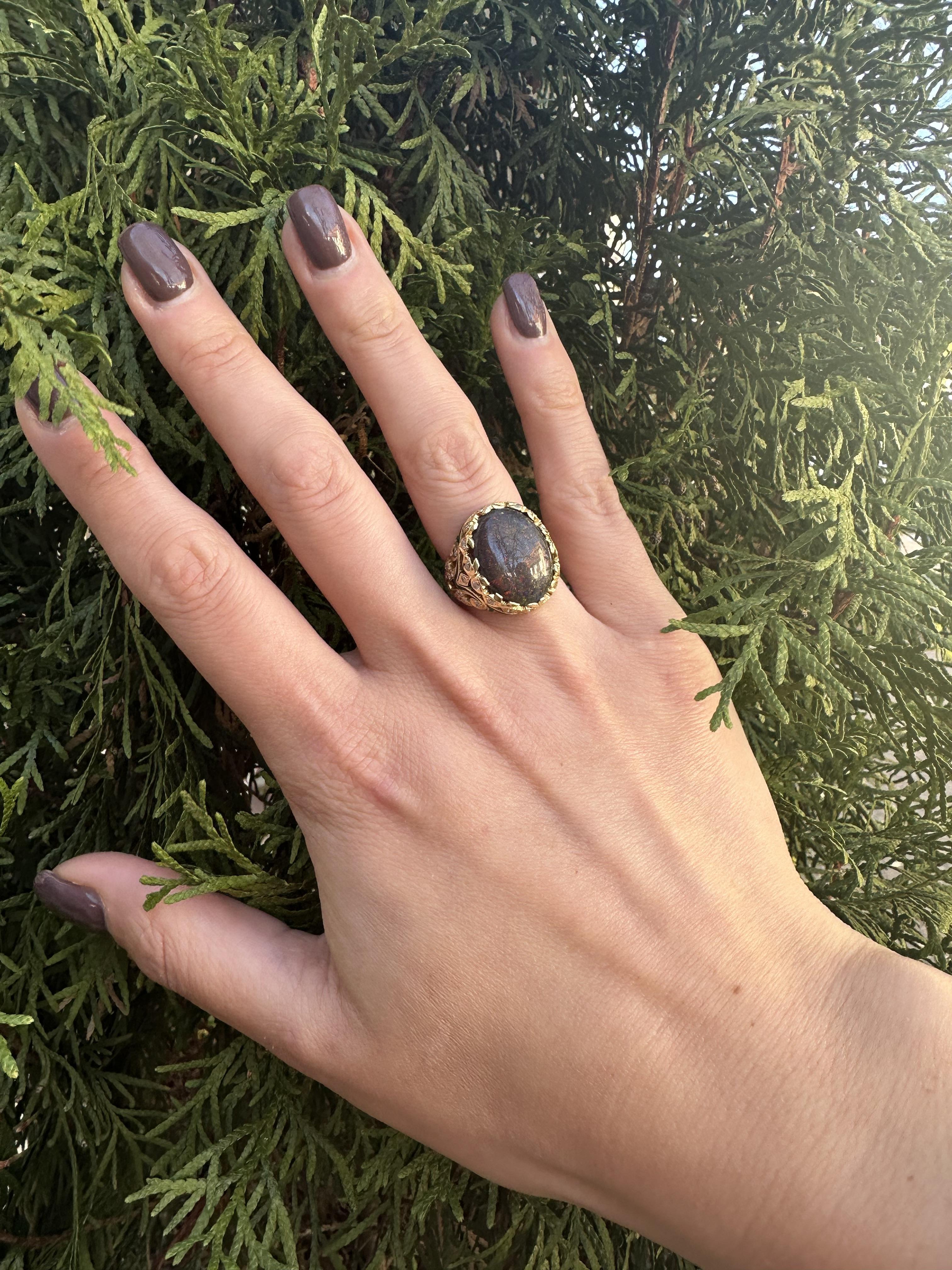--Stone(s):--
(1) Natural Genuine Opal - Oval Cut - Prong Set - Treated Black Color w/ Flecks Of Red and other Colors - 17.6x13.5mm
(34) Natural Genuine Diamonds - Round Brilliant Cut - Pave Set - White Color - SI-I Clarity - 0.65ctw