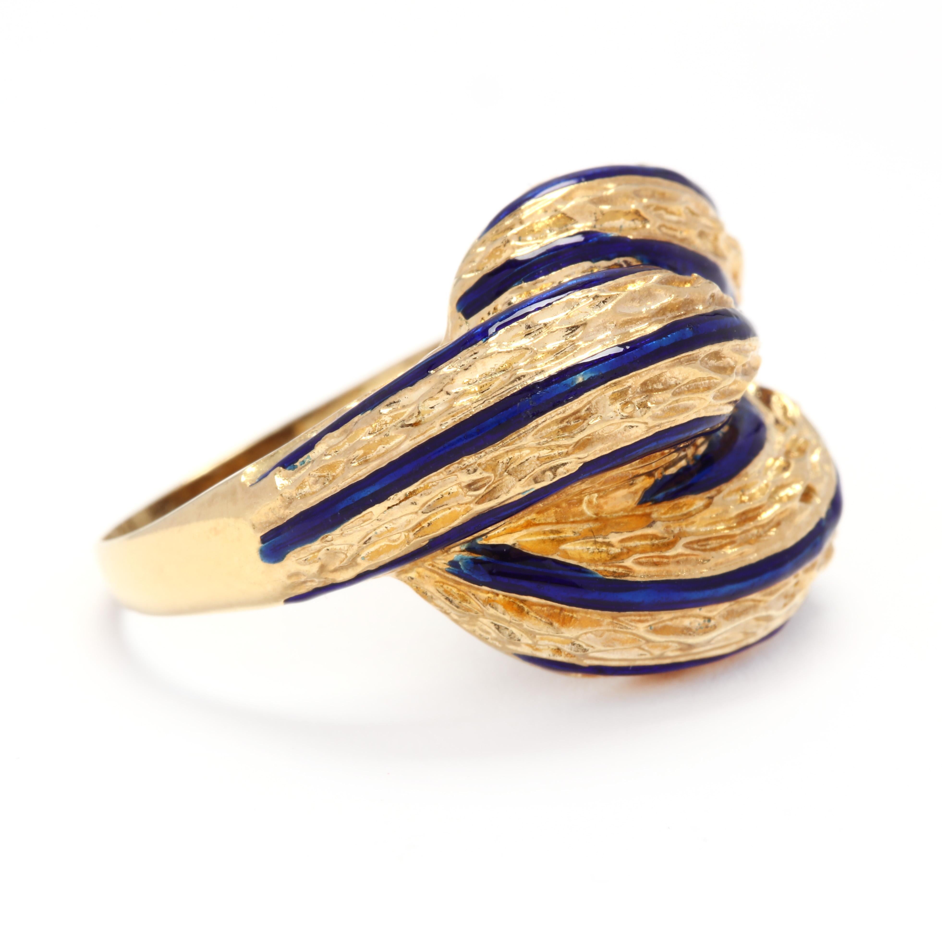 A vintage 18 karat yellow gold and blue enamel dome knot ring. This ring features three domed row in a knot motif with textured detailing and thin cobalt blue enamel lines throughout.

Ring Size 7.5

Width: 3/4 in.

5.87 dwts.

* Please note that