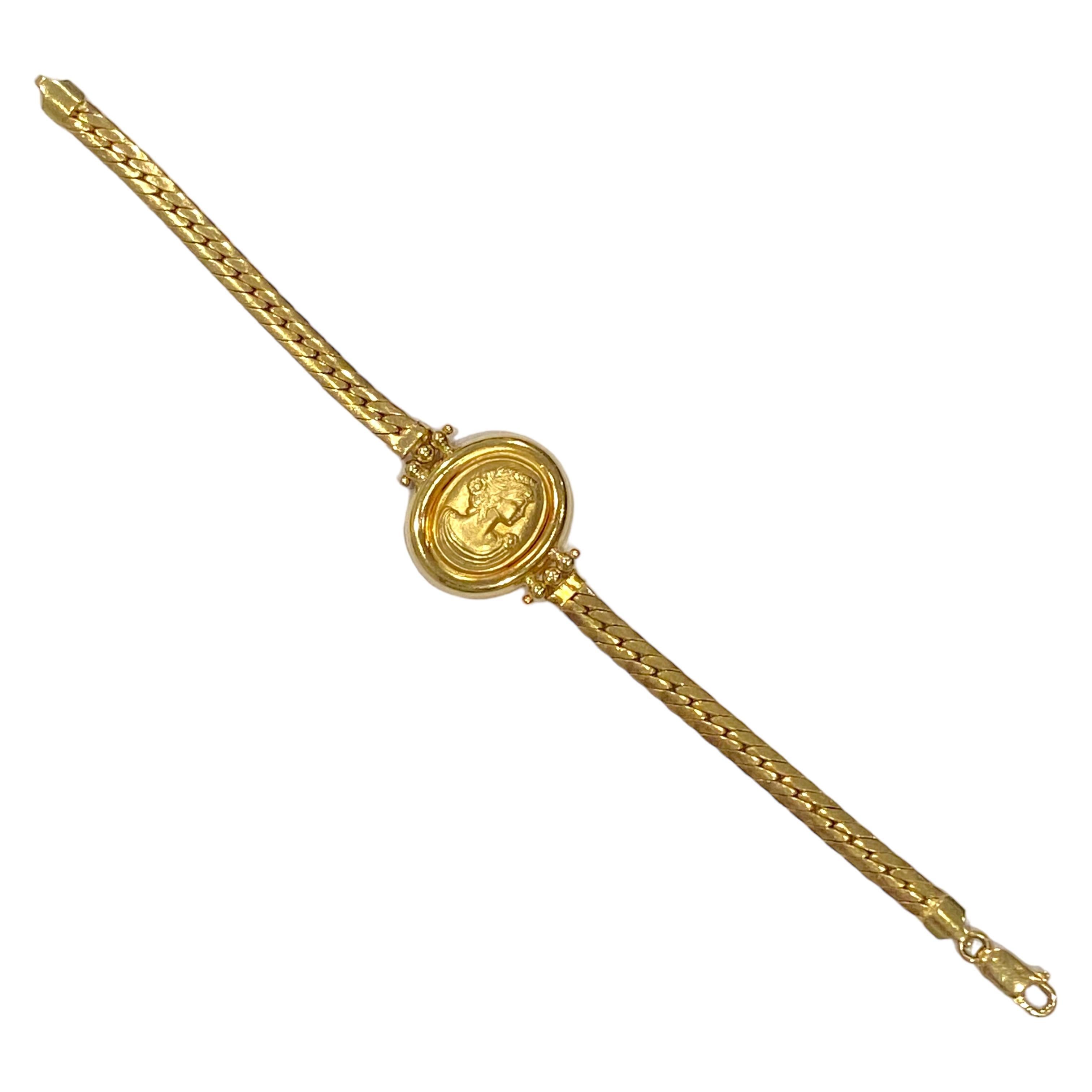 Crafted in 18K yellow gold, the bracelet features an oval cameo with a lady's profile, supported by a flat curb links style bracelet and a lobster clasp closure.
Bright polish and satin finish.
Measurements:
Cameo: 22.5 mm H x 19 mm W x 4.5 mm