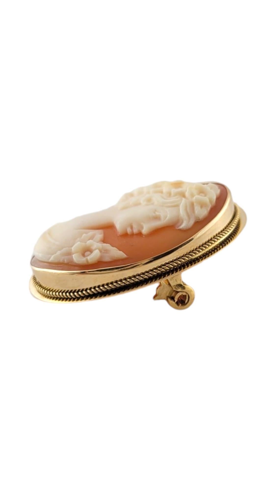 Vintage 18K Yellow Gold Cameo Pendant/Brooch

This gorgeous cameo brooch can double as a pendant and is crafted from 18K yellow gold!

Size: 26.97mm X 21.32mm X 5.72mm
Length w/ bail: 32.52mm

Weight: 2.49 dwt/ 3.88 g

Hallmark: 750

Very good