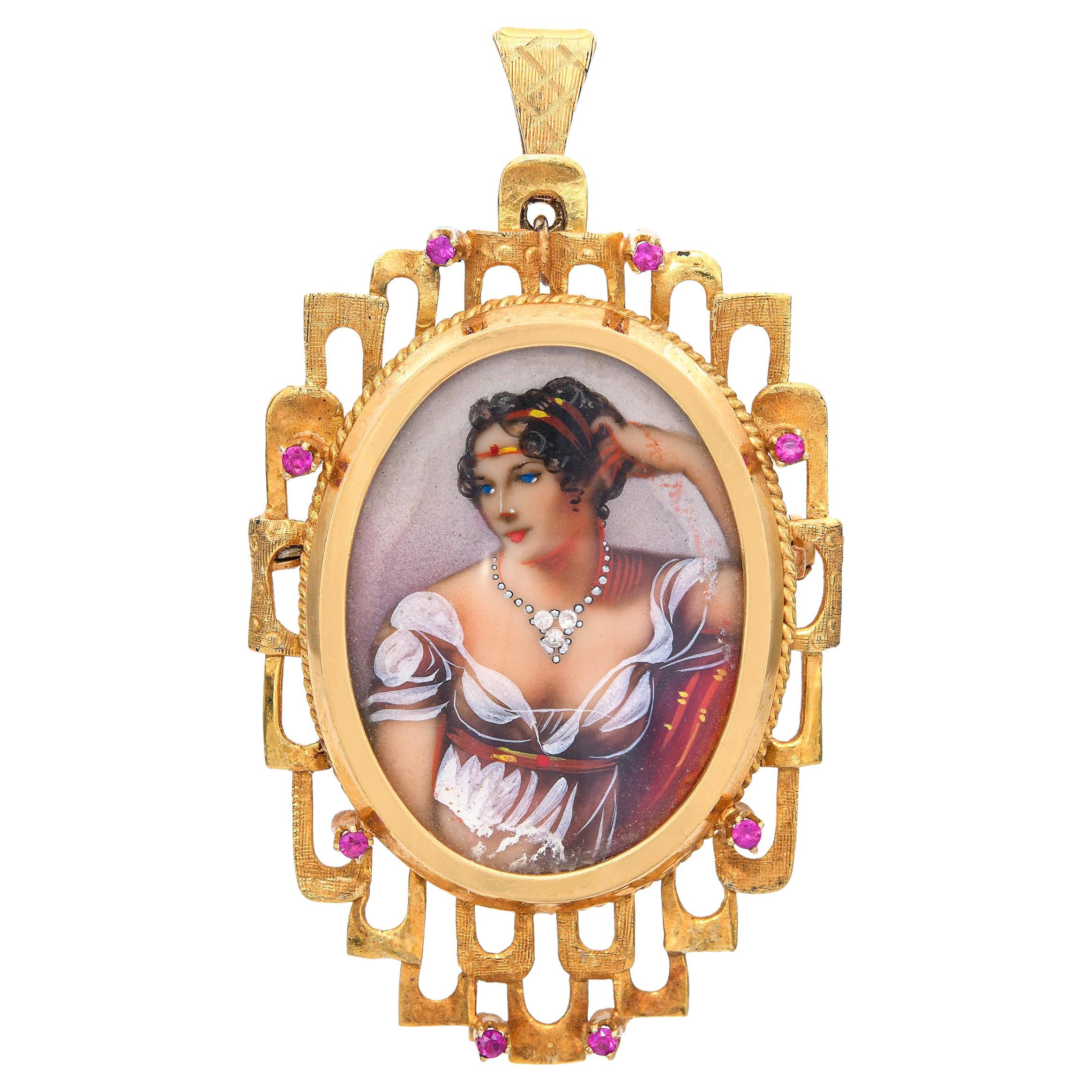 Ciondolo ritratto Minatare d
epoca in oro giallo 18 carati con rubino e diamanti