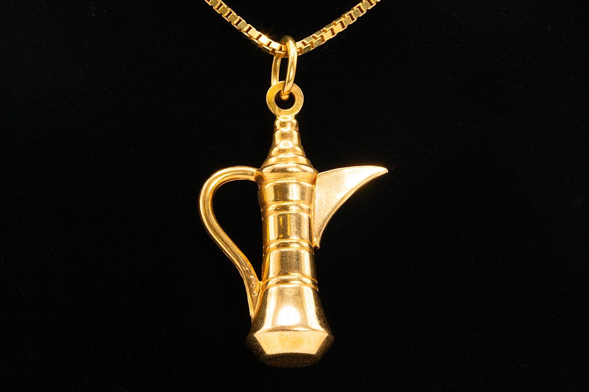 Vintage 18k Yellow Gold Dallah Coffee Pot Pendant Necklace

Make a lasting impression with this striking 18K yellow gold Dallah coffee pot pendant necklace—a refined blend of cultural heritage and timeless sophistication.

The intricately crafted