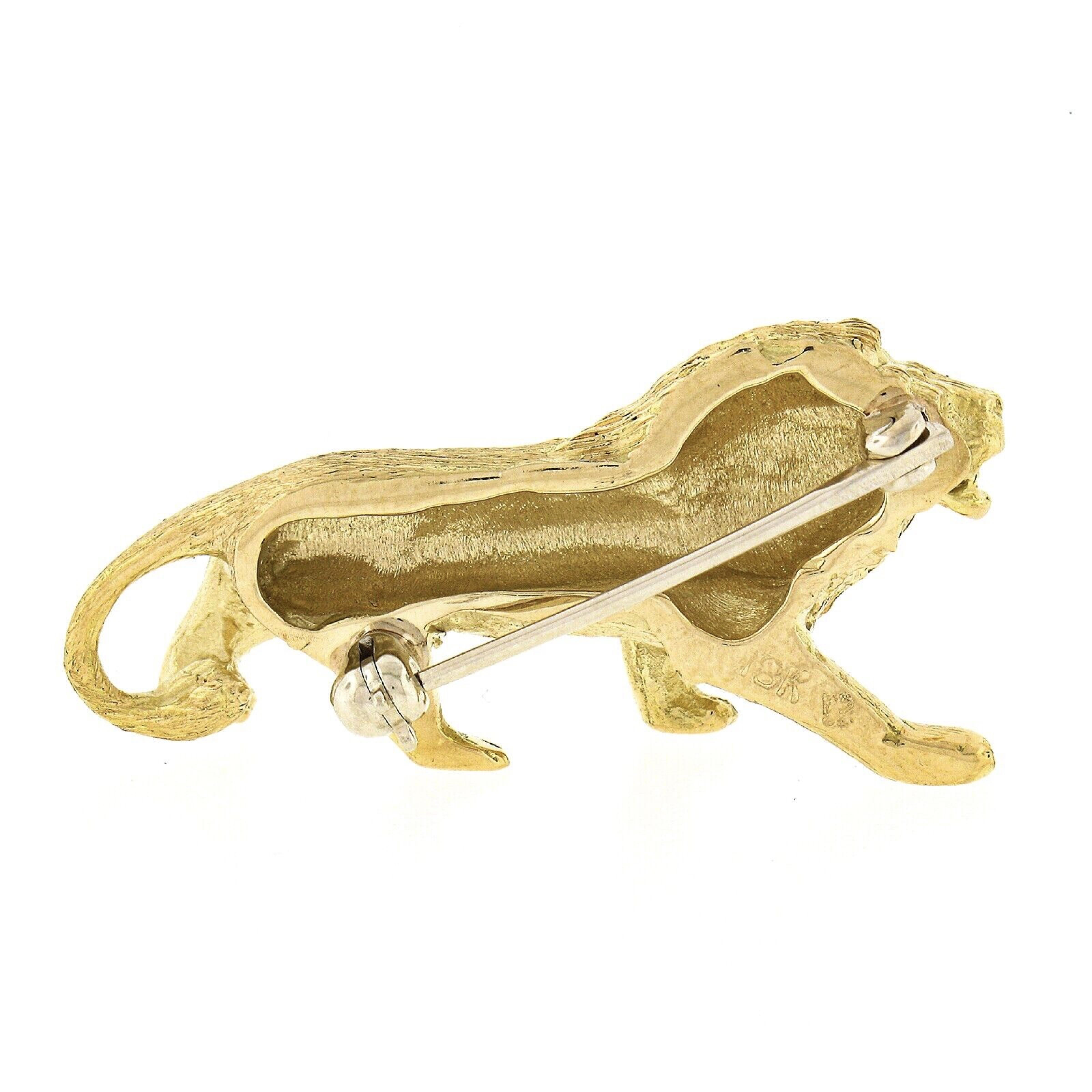 This wonderful vintage brooch/pin is crafted in solid 18k yellow gold and features a perfectly structured standing lion design with unique, and remarkably outstanding workmanship and texture that bring out maximum detailing granting an exceptional