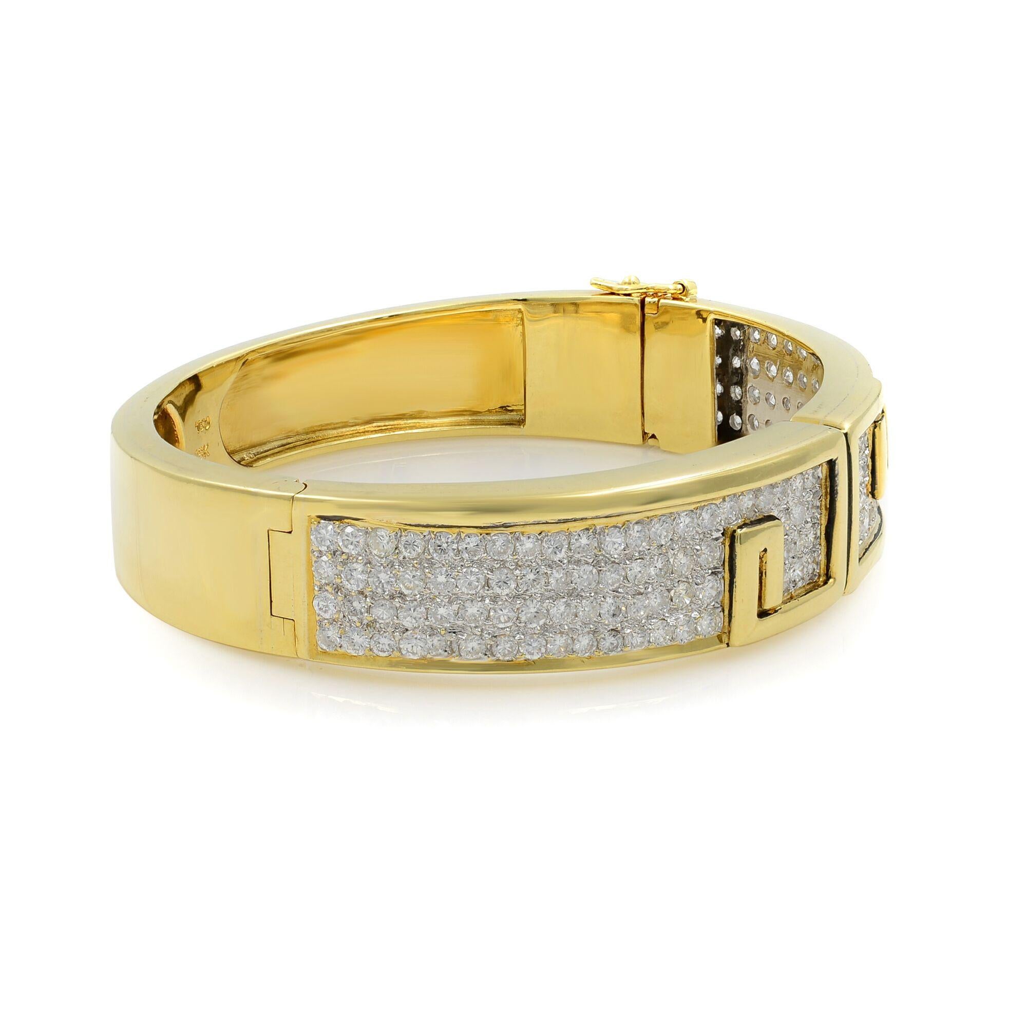 A vintage 18K yellow gold diamond bangle bracelet. A total weight of 6.00cts round cut  prong set diamonds.
Pre-owned excellent condition.
Length:6.25 inch
Width: 13.55mm 
Weight: 53.27 grams.