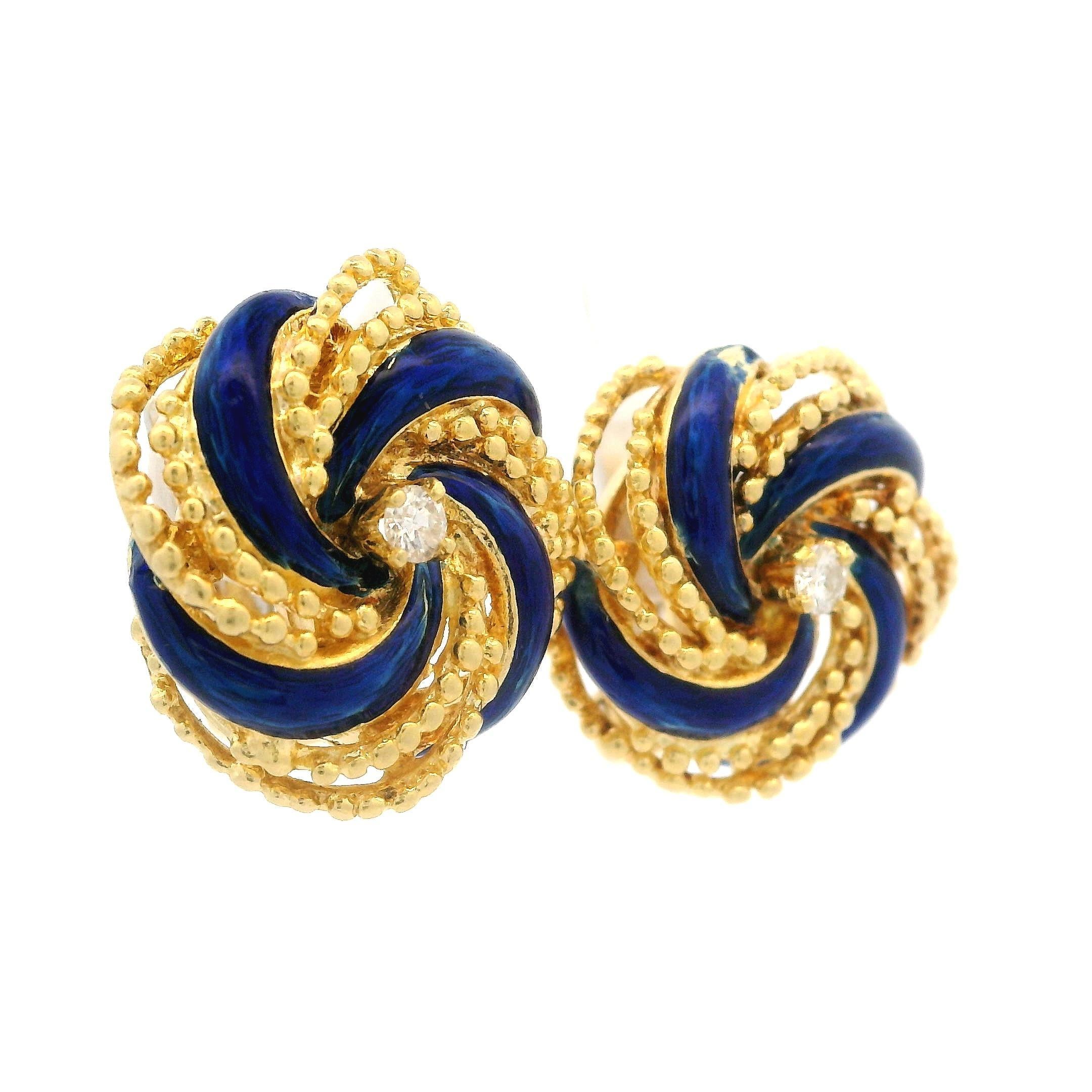 --Stone(s):--
(2) Natural Genuine Diamonds - Round Brilliant Cut - Prong Set - Nice White Color 
Total Carat Weight: 0.10 (approx.)

Material: Solid 18k Yellow Gold w/ White Gold Backings & Blue Enamel Work.
Weight: 11.98 Grams
Backing: Clip On