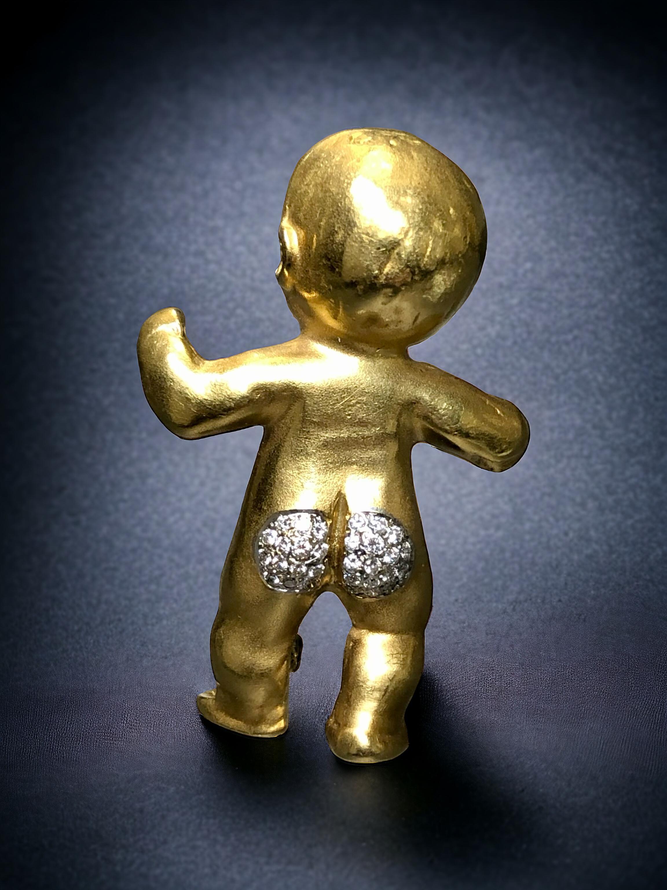 The cutest little baby brooch we’ve ever seen! It is hand crafted in 18K yellow gold and nicely detailed throughout and finished with approximately .31cttw G-H Vs clarity round diamonds pave set onto the baby’s bottom.


Dimensions/Weight:

Brooch