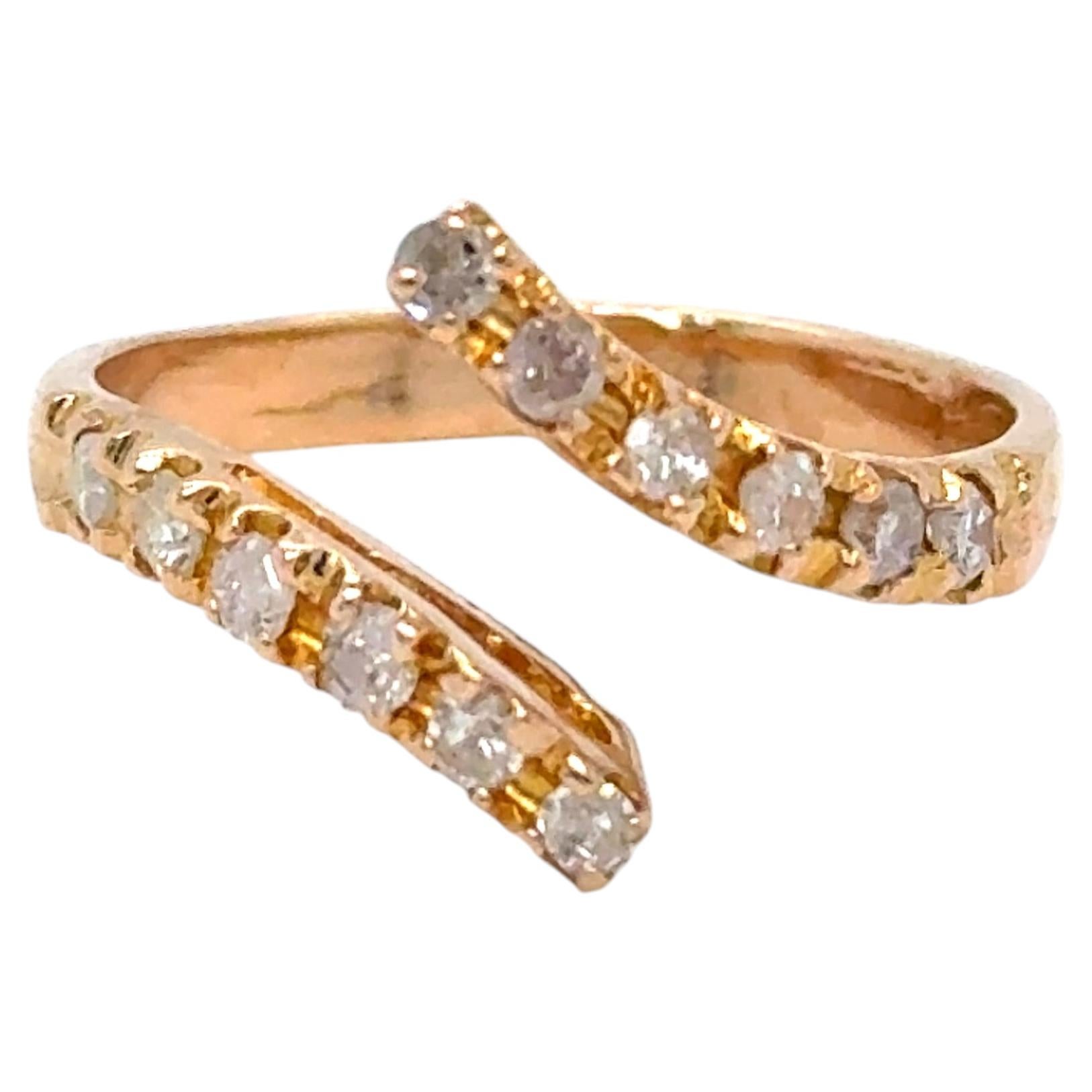 Bague vintage « ByPass » en or jaune 18 carats sertie d'un diamant de 0,48 ct. en vente