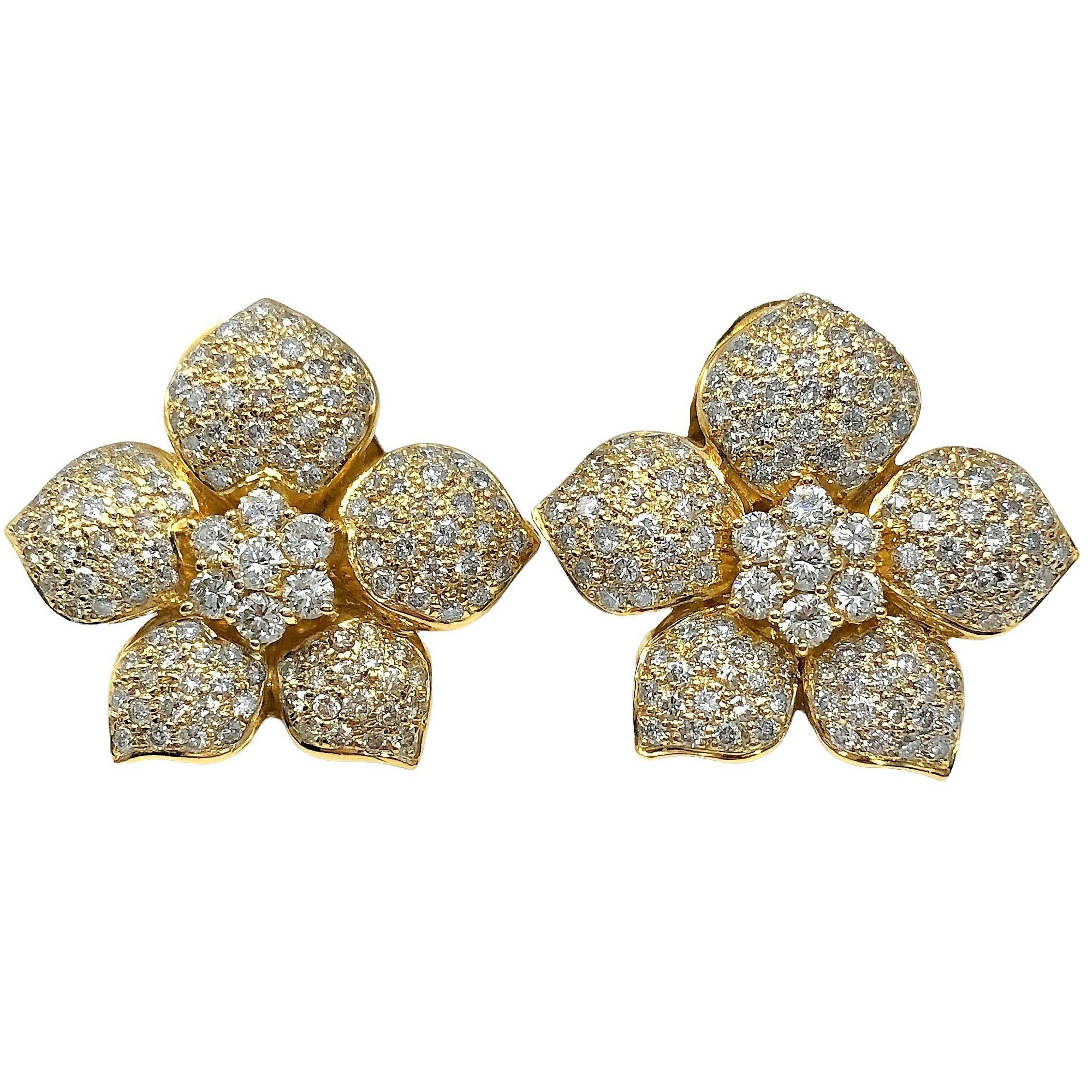 This lovely late-20th Century pair of 18k yellow gold and diamond, flower motif earrings is heavily pave set with round brilliant cut diamonds with 5.25Ct total approximate weight of overall H color and VS2 clarity.  Equipped with posts and 