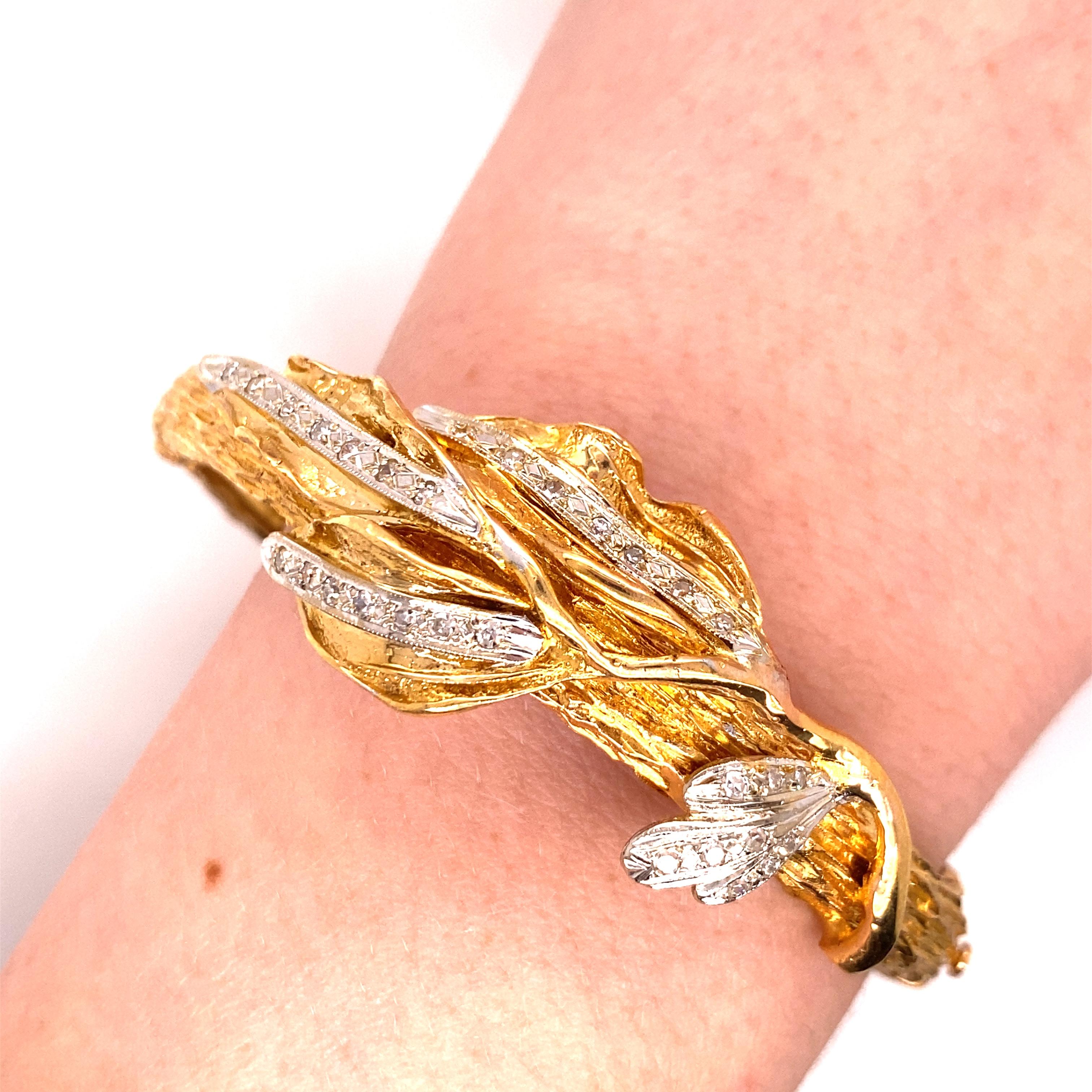Vintage 18K Yellow Gold Diamond Leaf Bangle - There are 30 single cut diamonds bead set in white gold in the leafs with a total approximate weight of .50ct with H - I color VS - SI clarity. The bangle is made of solid casted pieces and measures 7mm