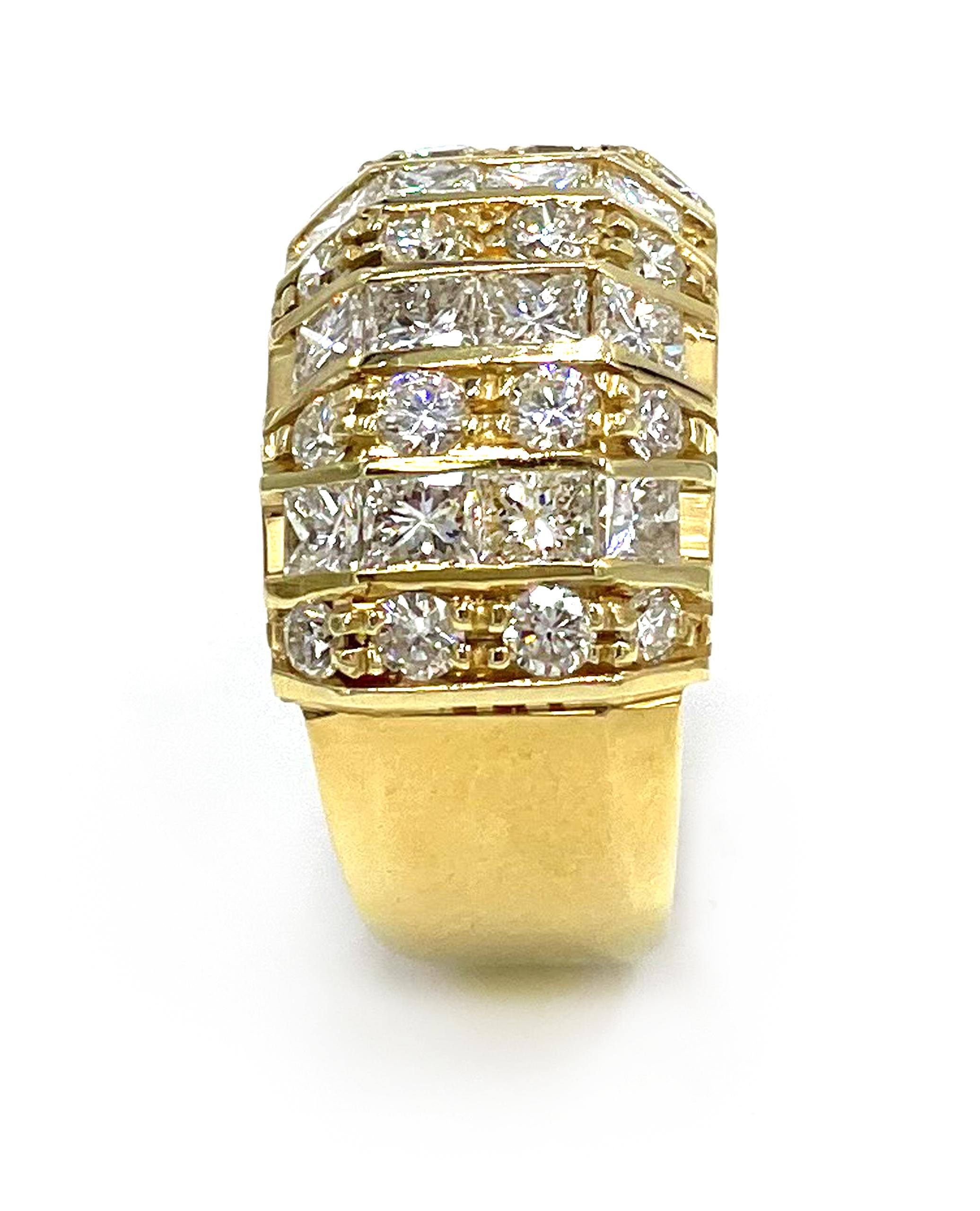 Vintage 18K yellow gold ring with 12 princess cut diamonds and 16 round diamonds, all totaling 2.05 carats: G color, VS Clarity. (Created circa 1985)

-Finger size: 6.5