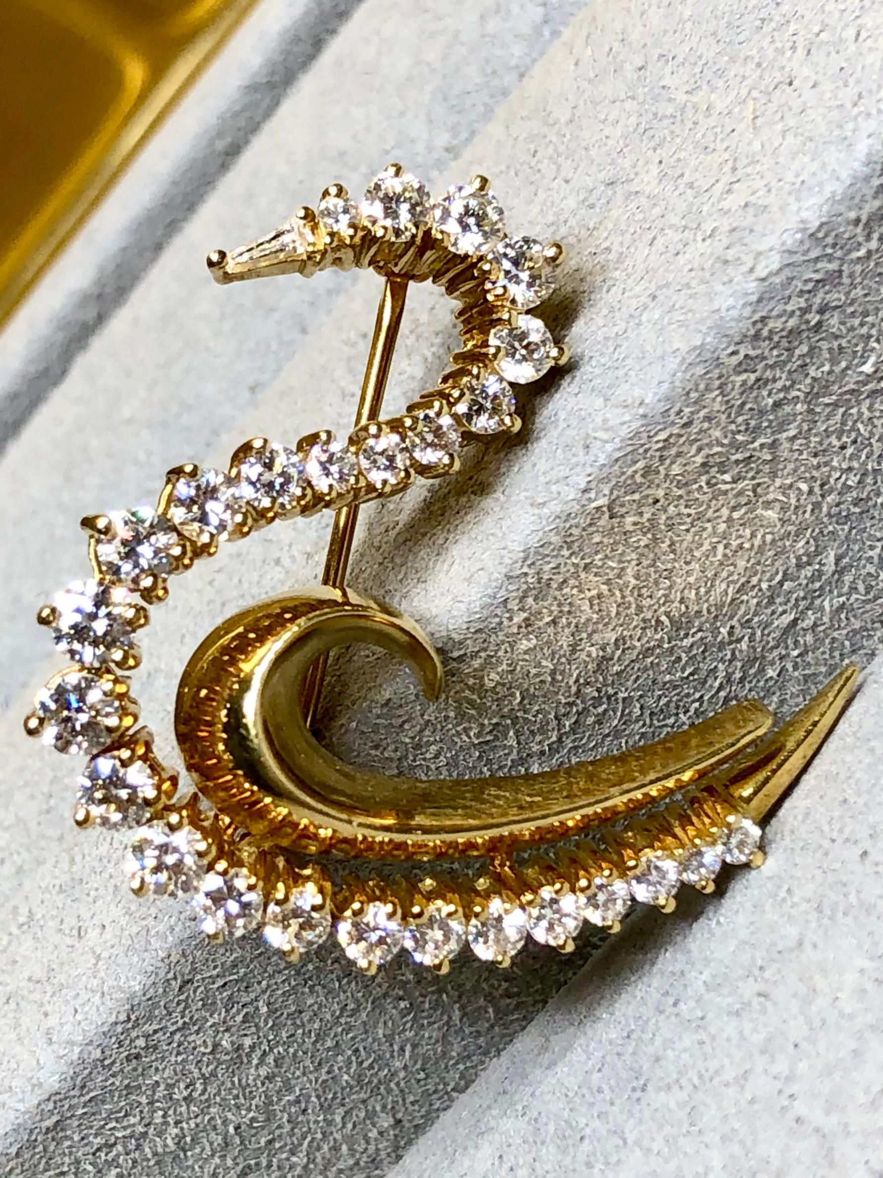 A wonderfully made vintage stylized swan brooch done by Schanfein & Tamis in deep 18K yellow gold and prong set with varying sized round diamonds averaging F-G in color and Vs1-2 clarity with a total approximate weight of 1.70ctw. Beautiful
