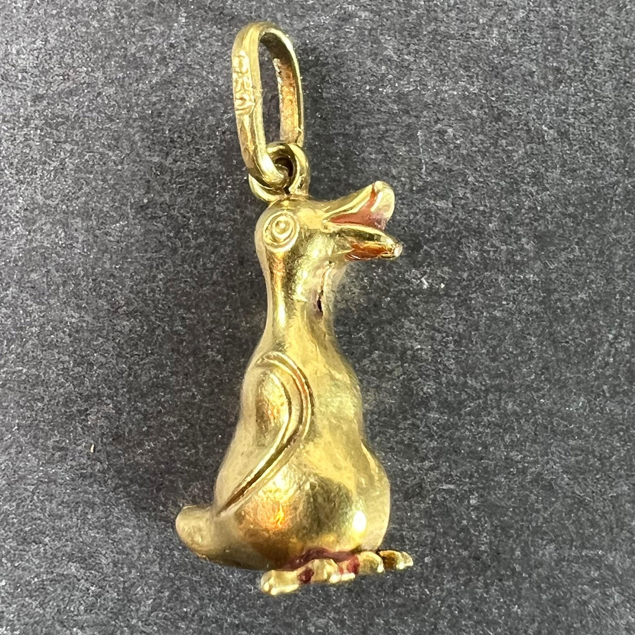 A vintage 18 karat (18K) yellow gold charm pendant designed as a bird or duck. Stamped 750 for 18 karat gold to the pendant bail.

Dimensions: 1.5 x 0.7 x 0.8 cm (not including pendant bail)
Weight: 0.89 grams
(Chain not included)