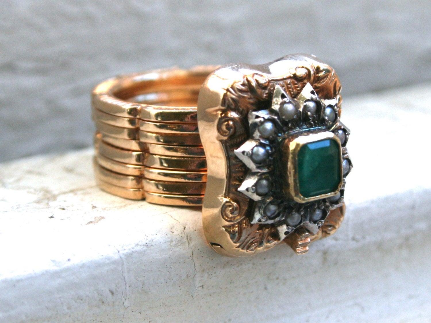 This Unique Vintage Emerald and Pearl Ring/ Bracelet is certainly unexpected. I've never seen another like it, and I know I'll never see another, and is just beautiful! Crafted in 18K Yellow Gold, the design is really a work of art and