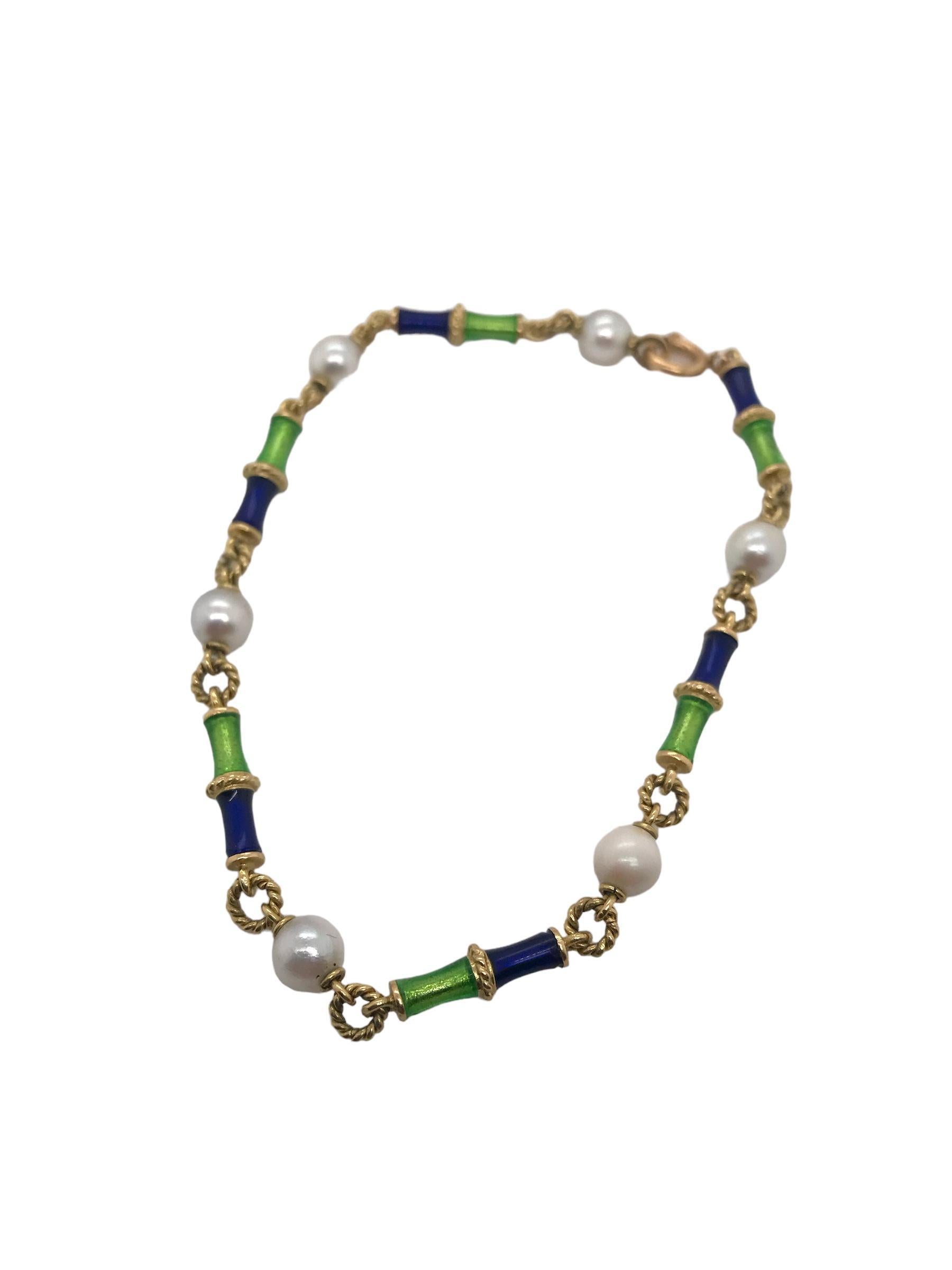 Such a stunning take on a pearl bracelet!
We love the blue & green enameling.

Bracelet Details
Material: 18K Yellow Gold
Weight: 8.2 Grams
Length: 7 1/2 Inches
6 - 5.3mm Round Cultured Pearls; White Color; High Luster

Item: V71KM2-8