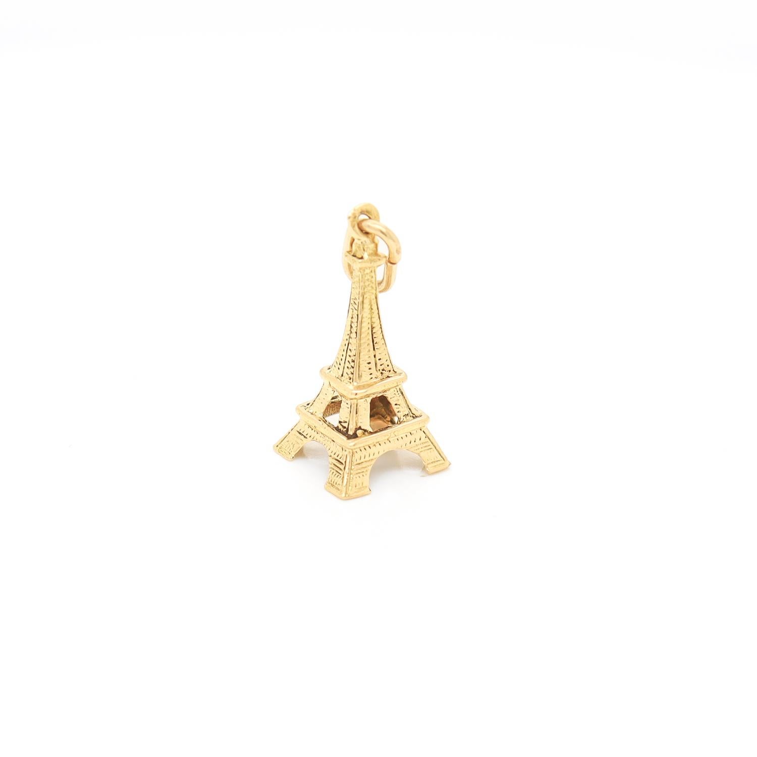 A fine vintage figural gold charm.

In 18 karat yellow gold.

In the form of the Eiffel Tower.

With an integral bail to the top.

Simply a wonderful charm!

(Chain for display purposes and not included with purchase.)

Date:
20th Century

Overall