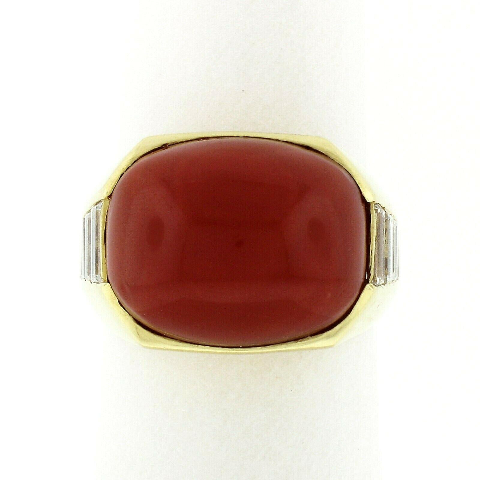 This truly breathtaking statement vintage ring was very well and solidly crafted in Italy from 18k yellow gold. The ring is set at its center with a gorgeous, natural coral stone that's certified by GIA. The coral has a truly desirable and rich