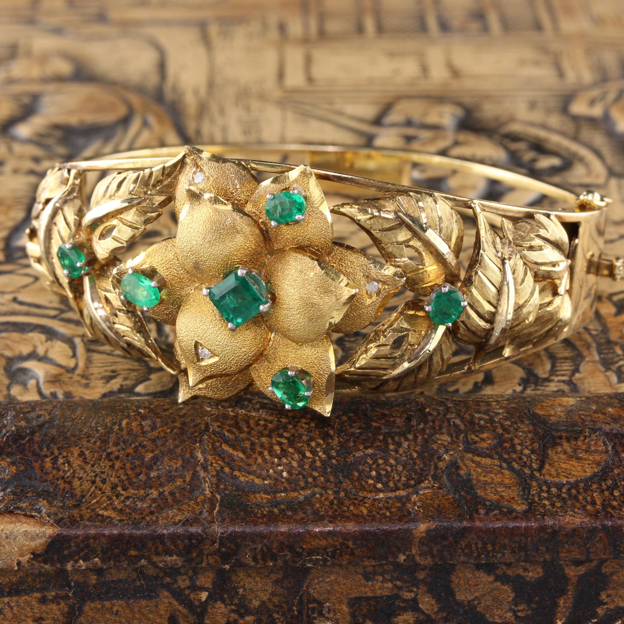 This amazing 18K Yellow Gold cuff has a hand engraved floral and leaf design with Colombian untreated emeralds and diamonds. Opens using hinge and clasp at the side of the bangle.

Metal: 18K Yellow Gold

Emeralds:  1.50 cts

Weight: 39.8 grams