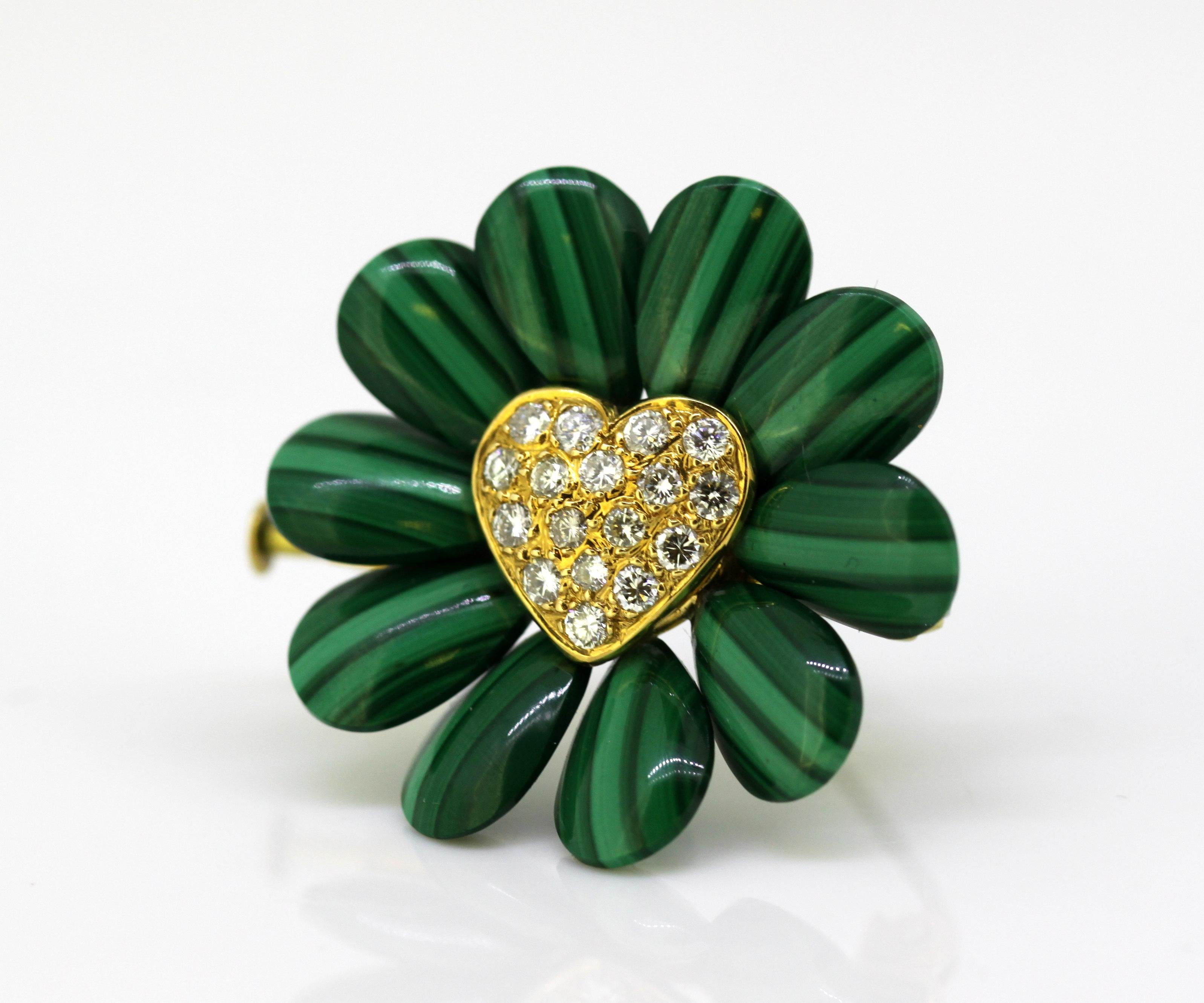 Vintage 18k yellow gold flower brooch with malachite and diamonds.
Circa 1970's.

Approx Dimensions - 
Size (Diamter x Depth) : 3 x 1 cm
Weight : 8 grams

Diamonds - 
Cut : Round
Number of Diamonds : 17
Approx Total Size in Carats : 0.68 CT
Clarity