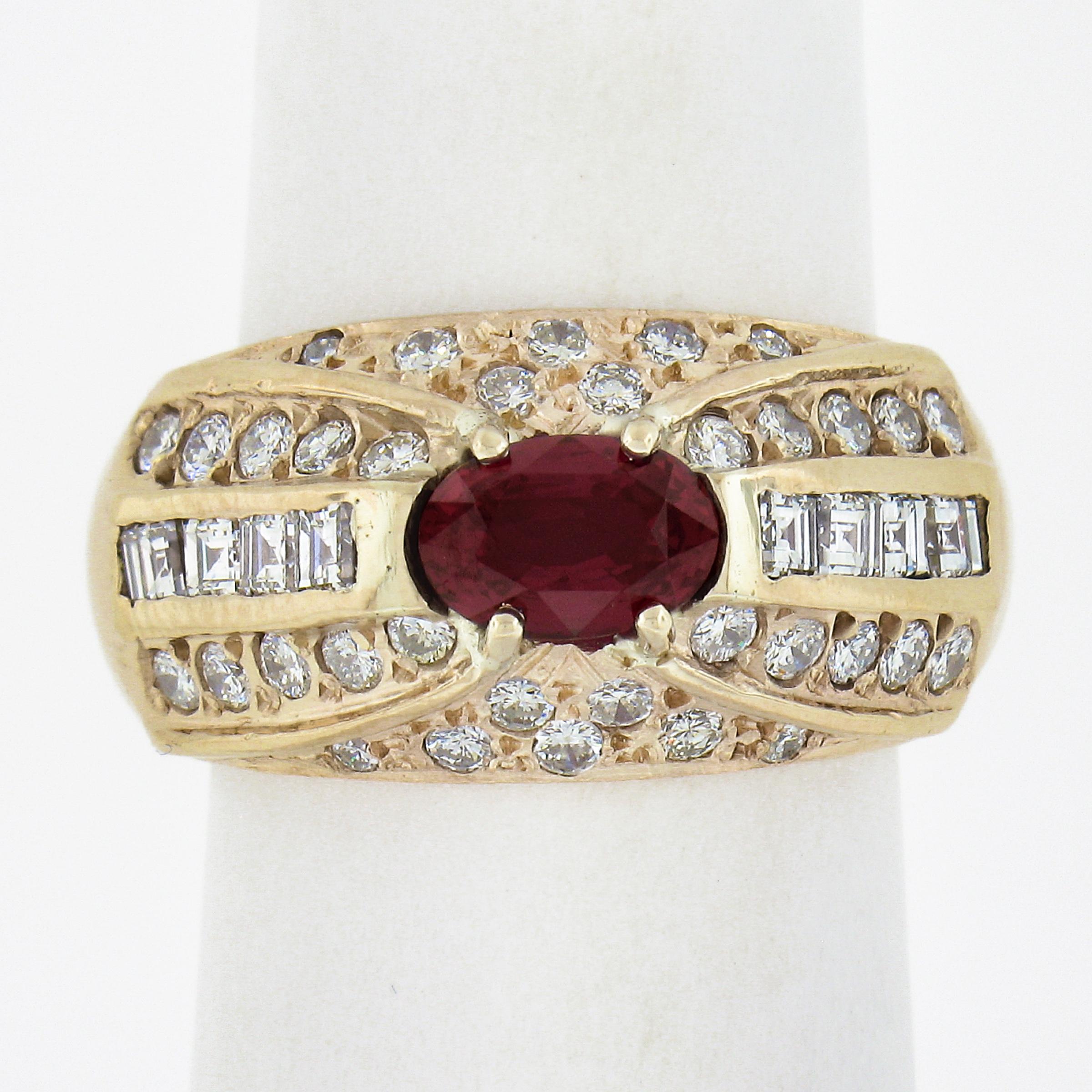 You're looking at a truly wonderful vintage ruby and diamond ring, refined in yellow gold and is set with fine quality gems throughout. The center stone is a GIA certified, Mozambique origin oval brilliant cut ruby that displays absolutely rich and