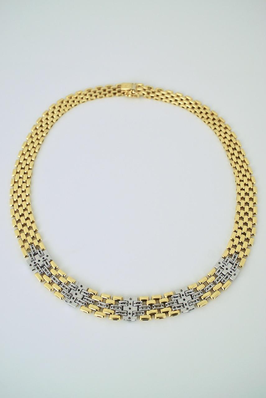 A vintage 18k yellow gold graduated diamond gate link necklace comprised of five rows of graduated links in a staggered brickwork type pattern with five sections at the front of the necklace of white gold set with diamonds - a classic and
