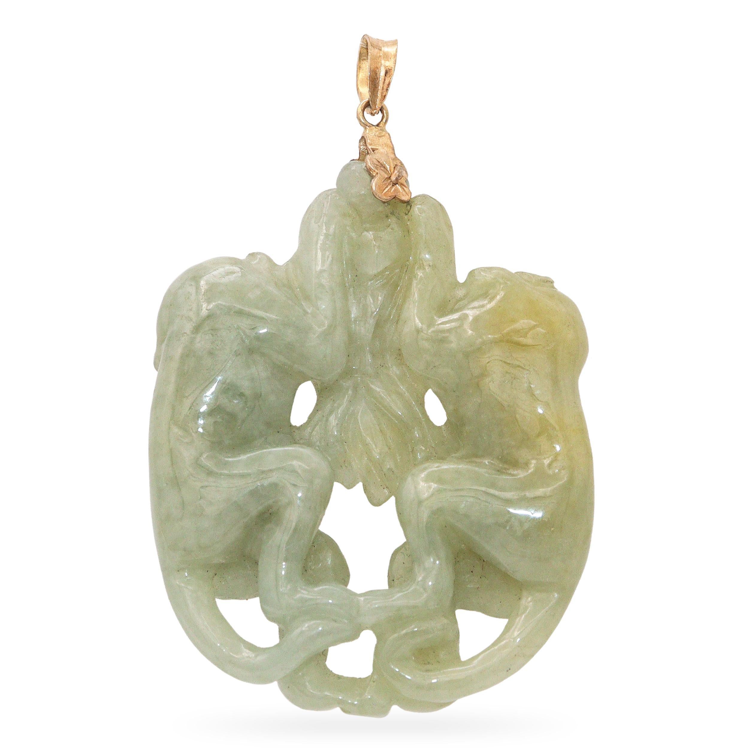 Vintage 18k Yellow Gold Two Monkeys Carved Jade Pendant, featuring a beautifully detailed jade carving depicting two playful monkeys. The rich green jade is carefully sculpted, symbolizing prosperity, intelligence, and harmony, while the 18k yellow